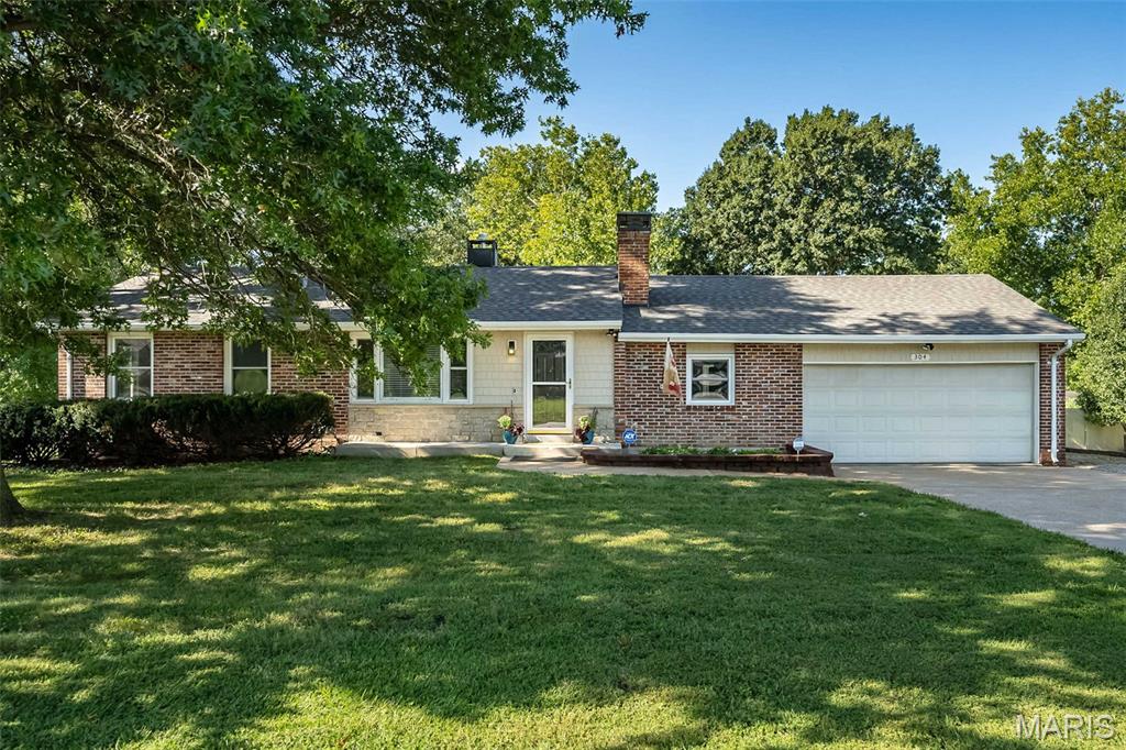 Welcome home to this beautifully updated ranch in the heart of Ballwin, offering the perfect blend of comfort, convenience, and peace of mind. Major improvements include a new warranted foundation system (2026), new carpet and fresh paint (2026), Air Comfort HVAC system (2023), and roof (2020)—making this home truly move-in ready. Located in the highly sought-after Rockwood School District, this home is just minutes from parks, golf, pickleball, shopping, restaurants, and major highways. Inside, you'll find over 2,000+ square feet of living space designed for your no-stress lifestyle. The bright and inviting living room features luxury vinyl plank flooring, crown molding, large windows, and a charming all-brick wood-burning fireplace. The spacious kitchen offers granite countertops, abundant cabinetry, a pantry, stainless steel appliances, and an adjoining dining area, with access to the patio, attached two-car garage, and fully fenced backyard. The main level includes three generously-sized bedrooms and two full bathrooms, including a spacious primary suite with a private ensuite bath featuring an easy-entry tiled shower and convenient main-floor laundry with a stacked LG washer and dryer. Fresh paint and plush new carpeting throughout the bedrooms create a clean, modern feel. The finished lower level adds over 900 square feet of flexible living space complete with a refreshment bar, powder room with rough-in for a future shower, and plenty of room for a family room, game room, home office, or fitness area. The unfinished section provides exceptional storage, a workbench, and a second washer and dryer—giving you laundry on both levels for ultimate convenience. Outside, enjoy a private quarter-acre corner lot with a black aluminum fenced yard, patio, gutter guards, and attic storage above the garage. Conveniently located just minutes from Ballwin Elementary, Vlasis Park, Ballwin Golf Course, The Pointe, Tennis, Gyms, Pickleball and all the shopping and dining Ballwin has to offer, this exceptional home combines thoughtful updates, an unbeatable location, plus a 12-mos Home Warranty for an incredible value. Don't miss your opportunity to make this Ballwin gem your own!
