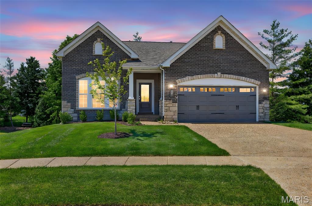 Why wait months to build when you can move into a brand-new, fully upgraded detached villa today? Perfectly positioned on a quiet cul-de-sac with a private, tree-lined backdrop, this exceptional home offers the luxury, convenience, and low-maintenance lifestyle today's buyers are searching for. Designed for easy, everyday living, the open floor plan features soaring 9-foot ceilings and seamlessly connects the kitchen, dining area, and great room, creating an inviting space for entertaining or simply relaxing at home. The designer kitchen showcases custom cabinetry, quartz countertops, stainless steel appliances, and abundant workspace for gathering with family and friends. The spacious primary suite serves as a private retreat with a walk-in closet, adult-height double vanities, a soaking tub, and a separate shower with seat and semi-frameless glass enclosure. Two additional generously sized bedrooms provide flexibility for guests, a home office, or hobbies. Enjoy the best of indoor-outdoor living with a maintenance-free deck overlooking the wooded backdrop and a large patio accessible from the walk-out lower level. An irrigation system keeps the lawn and landscaping lush, while the HOA takes care of all lawn maintenance and snow removal, including the driveway and sidewalk to your front door. Simply lock the door and travel with confidence. The expansive walk-out lower level features a 9-foot foundation, full bath rough-in, and egress window, offering outstanding potential for future finished living space, a fourth bedroom, recreation room, or guest suite. Conveniently located just minutes from major highways, shopping, dining, county parks, physicians' offices, and multiple hospitals, including the new medical campus at the I-70/Hwy. 61 interchange, this home offers both peaceful surroundings and unmatched accessibility. Brand new. Move-in ready. Private setting. Maintenance-free living. Low HOA fees. LOCK AND LEAVE LIFESTYLE! This is the lifestyle buyers have been waiting for.