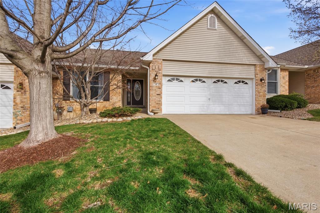 This well-maintained villa offers exceptional square footage and versatile living spaces across multiple levels but provides everything you'll need on the main level. The massive master bedroom provides generous room for a king-size suite and additional furnishings, while the huge lower-level family room delivers expansive square footage ideal for a home theater, game area, gym, or large gatherings.  The main level features hardwood floors throughout most living areas, delivering a clean, durable, and elegant foundation for the 2 bedrooms and 2 bathrooms. The recently updated kitchen includes crisp white cabinetry, speckled countertops, stainless-steel appliances, and a functional layout that flows seamlessly into the adjacent spaces. A convenient main-floor laundry room with cabinet storage and hookups keeps daily chores efficient and out of sight.  The master bathroom has been professionally refreshed with modern dark wood cabinetry, dual sinks, arched mirrors, a glass-enclosed shower with subway tile and hex mosaic flooring, and updated fixtures—creating a clean, high-end retreat. Additional baths are well-appointed for family or guests including a 3rd bedroom and 3rd bathroom in the lower level.  Other practical highlights include a brick fireplace in the living area, a large screened-in porch, multiple walk-in closets with wire shelving systems, ceiling fans, and abundant natural light from oversized windows. The floor plan includes flexible secondary bedrooms and easy access to the attached garage. Villa Life delivers clear advantages: low-maintenance exteriors managed by the association, no lawn or snow removal responsibilities, private yet connected community living, and single-level convenience options with lower-level expansion potential. Saint Charles is an outstanding location—historic, family-oriented, with top-rated schools, parks, shopping, dining, and quick access to St. Louis amenities and major highways.
This villa combines space, recent updates, and low-maintenance living in a prime location. Contact your agent today to schedule a showing.