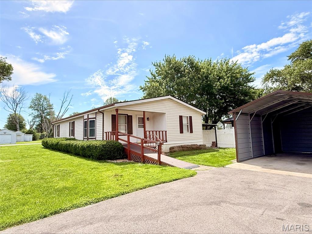 Welcome to easy, affordable living in this well maintained 3BR/2 full bath manufactured home situated on a quiet corner lot. This move-in ready home offers many updates including a new roof in 2025, new kitchen and utility room flooring. Spacious living room, eat-in kitchen with stainless appliances and plenty of cabinet space, plus separate dining room, and utility room. All 3 bedrooms feature newer carpet and nice sized closets. The large primary bathroom includes a walk in jet tub, double vanity and tons of storage. The hall bath includes an updated walk in shower and new toilet. Outside, the private corner lot provides some yard space, but is easy to maintain. Carport and a Cardinal storage building is perfect for extra storage. Red Bud school district. Call today for a showing!