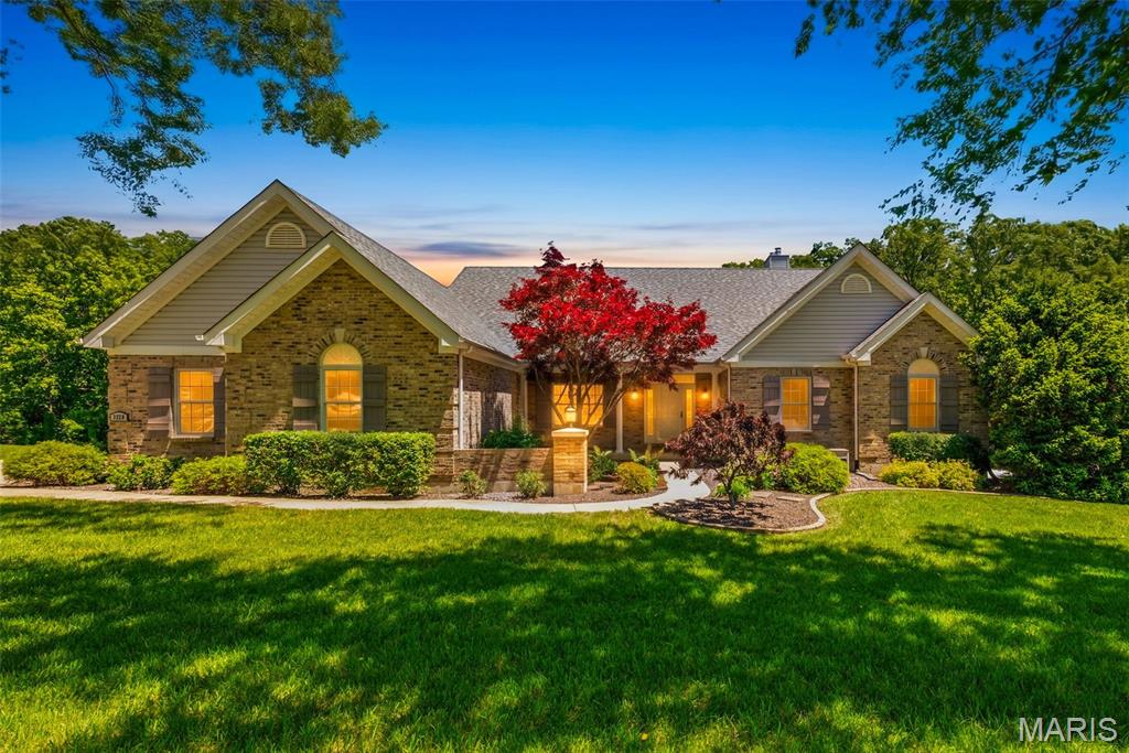 Welcome home to this stunning CUSTOM BUILT ATRIUM RANCH situated on 3 acres of usable land with stunning wooded views and exceptional privacy! With 4 bedrooms, 3 full baths, Offering over 3,500+ sq ft of living space including the finished walk-out lower level, this meticulously maintained home showcases true pride of ownership with no detail overlooked.
Step inside to experience the impressive atrium design filled with natural light, soaring windows, and picturesque views throughout. The divided floor plan features custom molding and millwork, coffered, vaulted, and 9-foot ceilings, beautiful woodwork, wainscoting, and thoughtfully designed living spaces perfect for both everyday living and entertaining.
The formal dining room is highlighted by oversized windows, elegant wainscoting, and coffered ceilings. The kitchen offers beautiful white staggered 42-inch cabinetry with crown molding, granite countertops, custom backsplash, designer ceiling details, and flows seamlessly into the breakfast room and light-filled Florida room/sitting area surrounded by windows overlooking the private backyard.
The spacious vaulted great room features a gas fireplace and opens to breathtaking views of the wooded setting. The primary suite is a true retreat featuring coffered ceilings, bay windows, abundant natural light, a luxury bath with dual vanities, freestanding soaking tub, oversized tiled shower with glass enclosure, and a large walk-in closet.
The finished walk-out lower level is built for entertaining with a large family room, second gas fireplace, built-in entertainment center, full wet bar with accent lighting, office with French glass doors, 4th bedroom/sleeping area, 3rd full bath, workshop/craft area with double doors leading to the backyard, and abundant storage space.
Outdoor living is equally impressive with a large custom composite deck featuring metal railings, staircase access to the expansive patio, mature landscaping, storage shed, and peaceful wooded surroundings with no rear neighbors. Additional features include a high-efficiency dual HVAC system, newer water heater, oversized 3-car side-entry garage, and beautifully maintained grounds.
This private retreat offers the perfect combination of luxury, functionality, and peaceful country-style living while remaining close to modern conveniences.