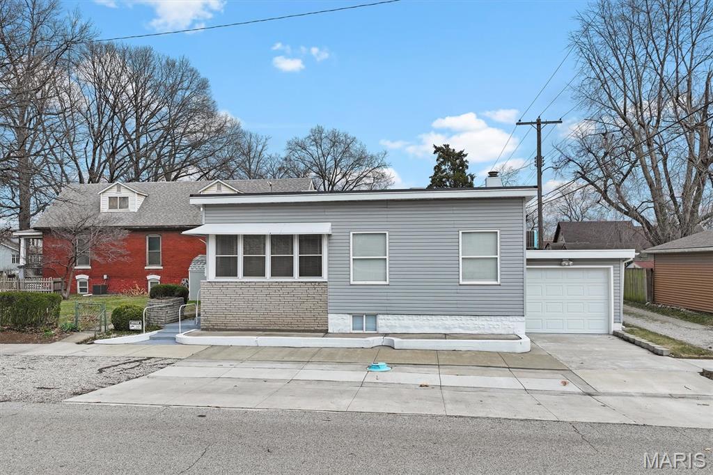 Well-maintained 2-bedroom home located at 2300 Edwards St in Granite City, offering a comfortable layout and practical updates throughout. The main level features hardwood flooring that extends through the living areas and bedrooms, adding warmth and durability. The inviting living room offers a welcoming space for relaxing or entertaining. The kitchen provides ample cabinetry and workspace with convenient access to the nearby dining area. The home includes two full bathrooms, with one located on the main level and an additional full bath in the basement, enhancing functionality for daily living and guests. Both bedrooms are appropriately sized, offering natural light and closet space. The basement adds valuable additional living space, ideal for a family room, recreation area, or flexible use to suit a variety of needs. Additional features include a 1-car attached garage for convenient parking and storage, along with a separate storage shed for tools, lawn equipment, or seasonal items. The yard provides space for outdoor enjoyment, gardening, or future improvements. Situated in an established neighborhood, the property offers easy access to local parks, schools, shopping, and dining options. Commuters will appreciate the convenient proximity to major highways and quick access to the greater St. Louis metro area. ALL information is deemed reliable but is not guaranteed and should be verified by the buyer and/or buyers agent before making an offer.