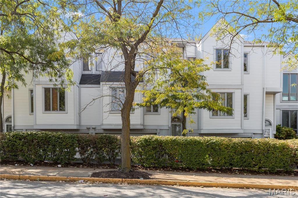 Welcome home to this gorgeously updated 2 bedroom 2 bathroom townhome in downtown St. Louis! The open floor plan has hardwood flooring throughout with bright living room with lots of windows and natural light accompanied by a cozy warm wood burning fireplace. The updated kitchen features quartz countertops and stainless steel appliances. The dining area walks out to a deck and fenced in courtyard with a pond. Upstairs you will find a large master bedroom with a huge walk in closet and second bedroom that can be used as an office or for children or guests. The bathrooms feature beautiful tile throughout and a tub and shower combo upstairs. This home is move in ready with a passed occupancy inspection and the washer, dryer and refrigerator are included in the sale. You can't beat the location in the heart of downtown near entertainment, shopping, dining and many major transit options. The community also has their very own pickleball courts. Come see this one today before its too late!
