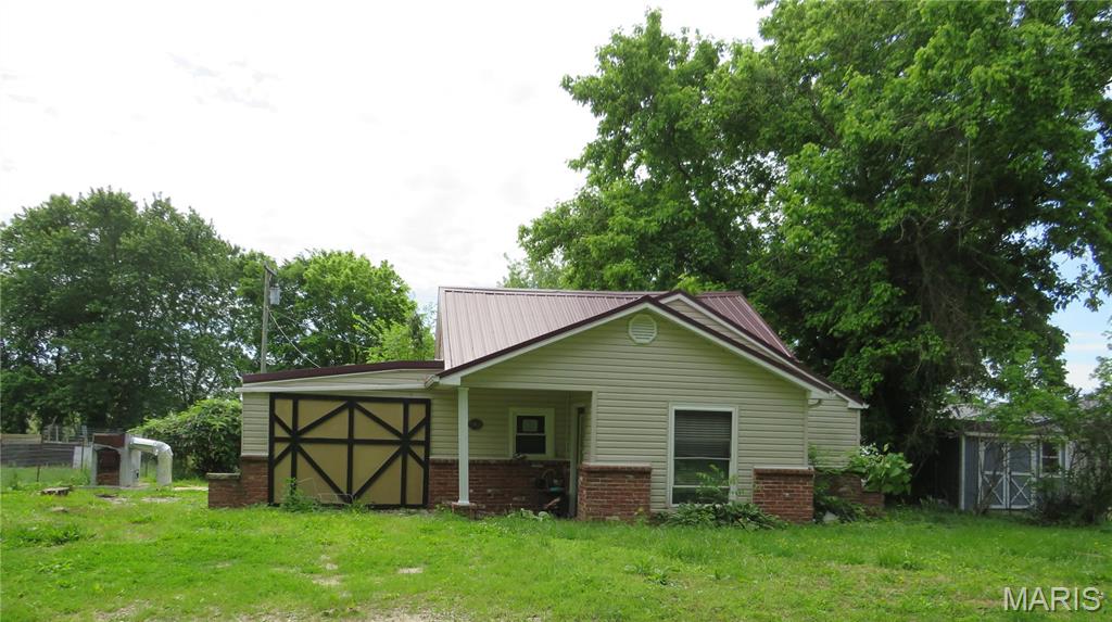 This charming 3-bedroom, 1-bath ranch home is situated on a beautiful shaded lot offers plenty of curb appeal. The maintenance-free exterior features vinyl siding and a durable metal roof, helping reduce upkeep for years to come. Additional features include a 1-car attached garage and a functional floor plan that's ready for updating. This property is priced to sell and is being offered as-is, making it an excellent opportunity for investors, or anyone looking to add their own updates and value.