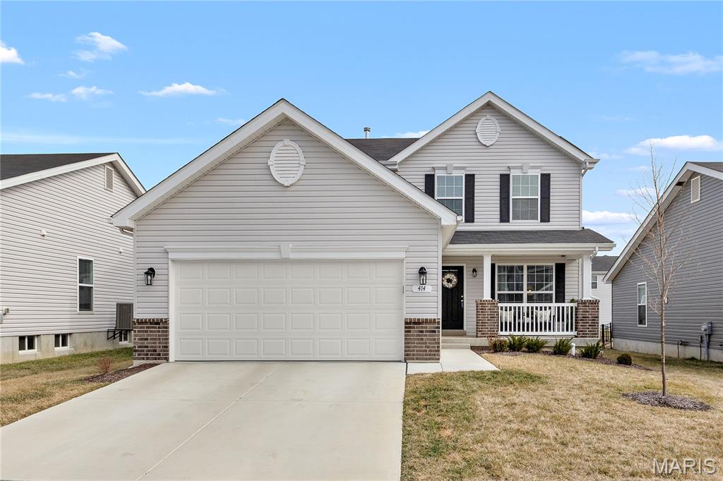 Built in 2024 and truly move-in ready, 414 Honor Hill Drive offers the benefits of new construction without the wait. Located in the Liberty subdivision in Foristell, this beautifully maintained two-story home combines modern finishes, functional living spaces, and everyday convenience. All required municipal inspections have been completed, and the occupancy permit has already been issued — providing added peace of mind and eliminating potential closing delays for the next owner.

The bright, open layout is filled with natural light and thoughtfully designed for both comfortable daily living and effortless entertaining. The kitchen features elegant quartz countertops, stainless steel appliances, ample cabinetry, and a center island with bar seating, along with a separate dining area for more formal meals or gatherings.

Luxury vinyl plank flooring and neutral paint throughout create a clean, cohesive look that complements any style of decor, while ceiling fans enhance comfort and energy efficiency. A convenient main-floor half bath adds functionality for guests.

Upstairs, the spacious primary suite offers a private retreat complete with an en suite full bathroom and a walk-in closet. Two additional bedrooms provide flexibility for guests, a home office, or changing household needs, along with a second full bathroom. A second-floor laundry room adds everyday ease and efficiency.

An unfinished basement provides excellent storage as well as the opportunity for future expansion. The attached two-car garage adds additional practicality.

Enjoy the charming covered front porch — perfect for morning coffee or relaxing evenings — enhancing the home’s welcoming curb appeal.

Liberty is a thoughtfully planned community featuring 214 homesites and outstanding amenities, including a scenic lake, gazebo, and more than 35 acres of nature-filled common ground. Residents enjoy a secluded 10-foot-wide asphalt walking trail with benches throughout, ideal for outdoor recreation and peaceful strolls. Conveniently located just off I-70 and Highway T, the neighborhood offers quick access to Wentzville Crossroads Shopping Center, as well as nearby wineries, golf courses, and other recreational opportunities. This home is located within the highly regarded Wentzville School District.

Thoughtfully finished, fully approved, and ready for its next chapter — this home offers a seamless transition into modern living without compromise.