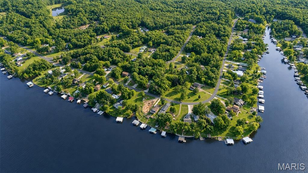 Summer isn't over just yet! Here's your opportunity to own a double lot in the highly sought-after gated community of Indian Hills Lake. Lots 943 & 944 combine for 0.56+/- acres on the west side of the lake, offering beautiful water views and a convenient location just five minutes from the community entrance and approximately ten minutes from I-44.

What truly sets this property apart is the community easement directly behind the lots. With no future structures permitted within the easement, the open space behind the property and a clearing would result in beautiful lake views year-round. Whether you're dreaming of building a lake home, creating a weekend retreat or simply investing in your own piece of Indian Hills, this property offers plenty of possibilities.

Life at Indian Hills is about more than just the view. Residents enjoy access to the community beach, playgrounds, tennis courts and a stocked 326+/- acre lake, offering endless opportunities for boating, fishing, swimming and days spent on the water. A security-enforced gated entrance, street maintenance and snow removal are just a few of the additional benefits of this established lake community.

Great lake lots are becoming more and more difficult to find — especially two of them together with a view like this! Schedule your own private showing today and start enjoying life at the lake before the leaves begin to fall! For additional community information, visit ILPOA.Org