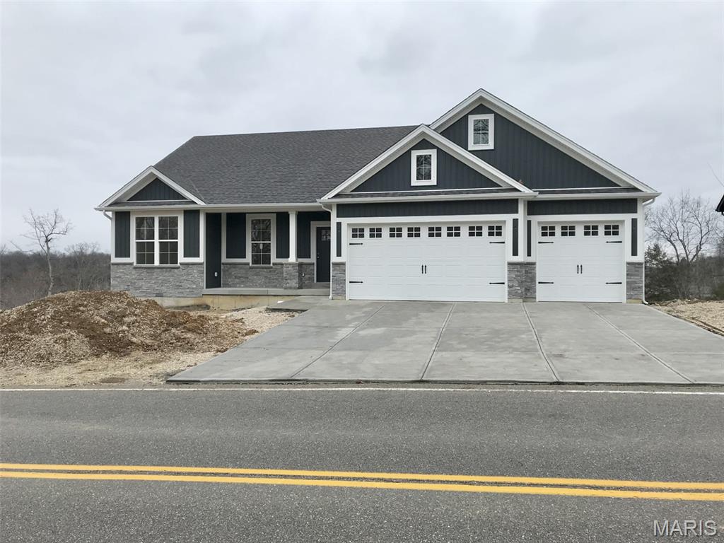 Under construction! The building process has started on this 3-bedroom, 2-bath Ranch home. Check out all the options-Craftsman Front, oversized 3 car garage, Walk-out Basement, covered 12x12 Composite Deck with Front porch option. The Interior will not disappoint - 9 ft ceilings throughout with vaulted ceilings in the Great room and Kitchen area, Open Staircase with wrought Iron spindles, Huge Island in Kitchen, upgraded kitchen cabinets with soft close doors and drawers, double door pantry in Kitchen, crown molding on Kitchen Cabinets, Granite Counter-tops, Kitchen Backsplash with under cabinet Lighting, built-in Microwave, Stainless Appliance upgrade, Walk-in Primary bath closet, Double Bowl sink in Primary bath with a 5 ft shower and shower doors. This is an exceptional Home that also backs up to trees and woods. Pictures are of recently sold homes in that area.