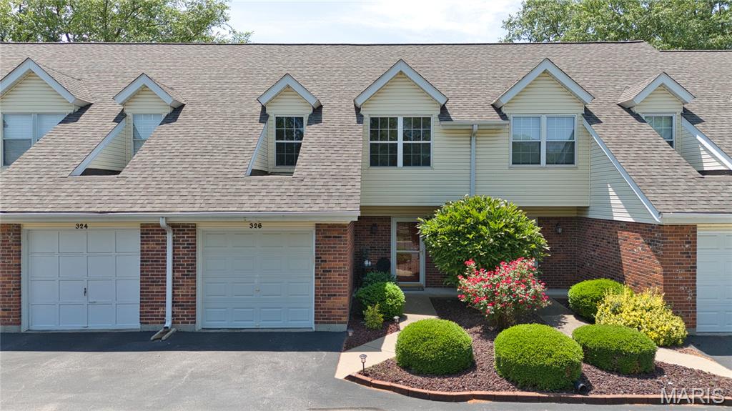 Talk about a refresh! Welcome to 326 Devonshire Ct Unit E — completely renovated from top to bottom with stylish updates, modern finishes and low-maintenance living. 

This move-in ready townhome features 2 bedrooms, 1.5 baths, second-floor laundry, an attached 1-car garage, and an additional assigned parking space. Inside, you'll find fresh Sherwin Williams paint, all new doors and hardware, updated lighting, new baseboards, fresh carpet upstairs, and beautiful new laminate flooring on the main level. The living area is highlighted by a stunning shiplap accent wall while the completely renovated kitchen features new cabinetry, quartz countertops, backsplash, pantry addition, and a new gas range. Both bathrooms have been refreshed with updated finishes. The refrigerator, washer, and dryer are all included in the sale.

Beyond the cosmetic updates, the major mechanical systems have also been refreshed in recent years, including the furnace and water heater in 2021, A/C in 2020, and roof in 2024.

Enjoy community amenities including the clubhouse and pool, both within walking distance. The HOA covers water, sewer, trash, and portions of the insurance. 

Conveniently located near Hwy 70 and Mid Rivers Mall Drive, with easy access to local restaurants, the St. Peters Rec-Plex, Downtown Cottleville, and Hwy 364.