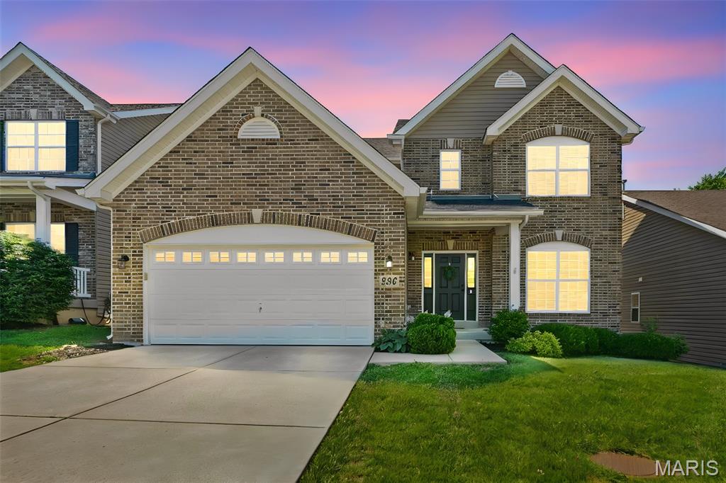 296 Cambridgeshire Court, the space you need, the updates you want, and the location you'll love! Where timeless design and exceptional living space come together in one beautiful home. Situated on a cul-de-sac, this impressive 2-story home offers over 2,600 square feet of living space plus a finished walkout lower level.

Step inside to discover 9-foot ceilings on the main level, hardwood laminate flooring, freshly cleaned carpets, elegant arched openings, and an open, inviting floor plan designed for both everyday living and entertaining. The spacious great room features a stunning bay window, abundant natural light, and a gas fireplace with marble surround, creating a warm and welcoming focal point.

The kitchen is sure to impress with 42-inch cabinetry with crown molding, GE Slate appliances, and a sunny breakfast room highlighted by a bay window and direct access outdoors.

A beautiful spindled staircase adds architectural character as it leads to both the upper and lower levels. Upstairs, you'll find generously sized bedrooms, including a spacious primary suite with double entry doors designed for comfort and privacy.

The finished walkout lower level provides valuable additional living space ideal for entertaining, a media room, game room, fitness area, home office, or playroom. Don't forget the FULL bathroom!

Recent updates include a new roof in 2023, offering peace of mind for years to come. Conveniently located within the Fort Zumwalt School District and just minutes from parks, shopping, dining, and major commuter routes, this move-in ready home delivers the perfect combination of location, upgrades, and space.