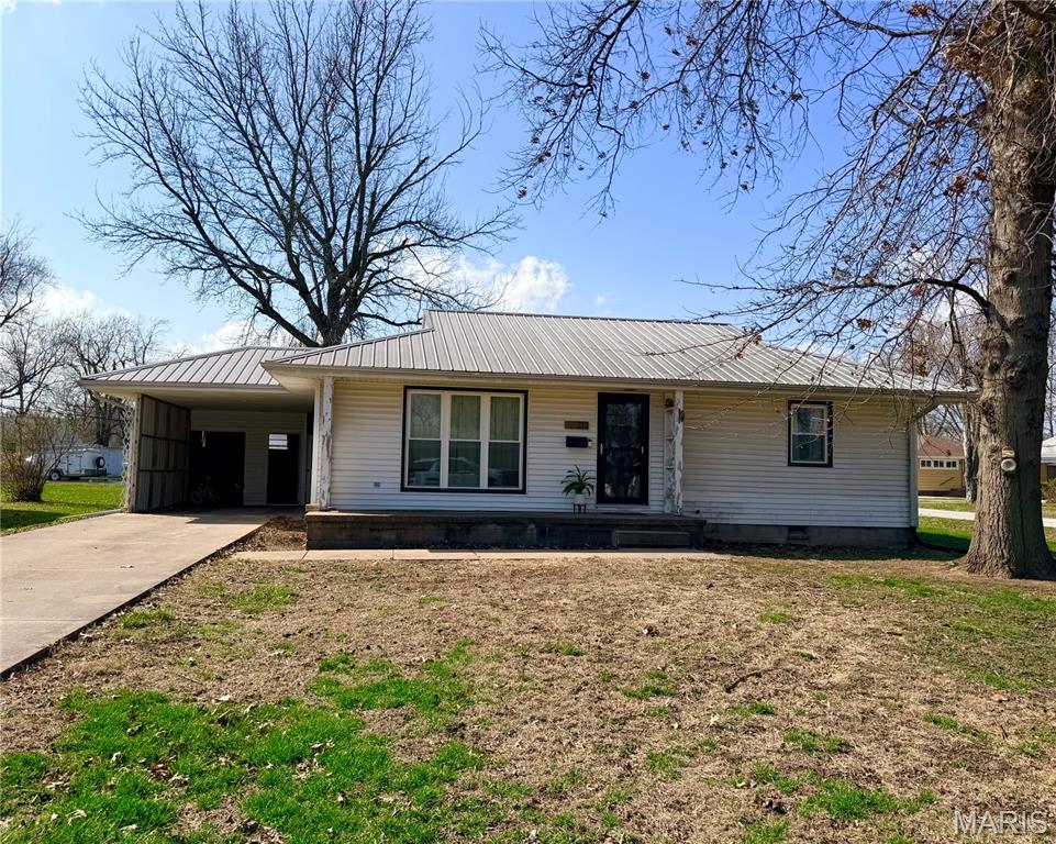 Office Exclusive Listing - 2 beds, 1 bath Ranch home.  Hardwood Floors.  13x17 attached carport with a large storage closet.  24x24 Morton Building, featuring (2) 12x24 carports.  One carport has a poured foundation, which could be used as an outdoor patio.  Newer Metal Roof.