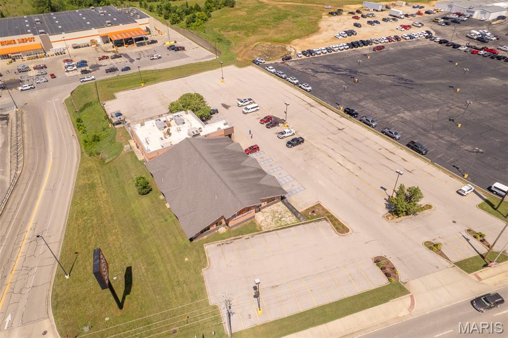 Exceptional leasing opportunity in one of the area's most visible and high traffic commercial corridors. Offering approximately 10,500 sq ft +/- of versatile commercial space, this property is currently operating as a restaurant and comes equipped with valuable existing infrastructure including a walk-in cooler, walk-in freezer, and four restrooms (two customer and two employee restrooms in the rear). The expansive 92'x 58' dining area provides an open layout ideal for a variety of business concepts, while the generous 180 parking spaces offer ample convenience for customers, employees, and events. Positioned in prime commercial location with outstanding visibility and steady daily traffic, this property presents endless possibilities for restaurants, entertainment venues, retail, event space, fitness facilities, medical offices, specialty markets, or countless other commercial ventures. Whether you're expanding an existing business or launching a new concept, this highly adaptable space offers the size, location, and exposure needed to succeed. Rare opportunity to lease a large commercial property in a premier location with unlimited potential.