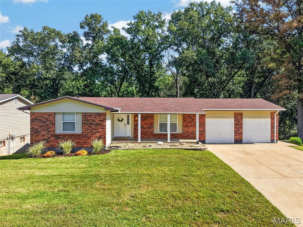 Welcome to this spacious 5-bedroom, 2-bath brick ranch with an open floor plan. A large entry foyer welcomes you into the Great Room, featuring a wood-burning fireplace & door leading to the deck overlooking beautiful wooded common ground. The eat-in Kitchen offers custom cabinetry, pantry, & plenty of space for gathering and entertaining. The Primary Bedroom Suite features a full bath, while the front bedroom offers flexibility as a bedroom or home office. Engineered wood flooring and carpet in the bedrooms add warmth throughout, and both full baths have been updated. The walk-out LL provides more living space with an additional bedroom featuring an egress window, bonus room, large laundry room, and abundant storage. Enjoy the outdoors from the covered patio or spacious deck overlooking the peaceful wooded setting. Additional features include a Nest thermostat, oversized 2-car garage , newer Roof/Gutters, and HVAC with Heat Pump. A wonderful opportunity to enjoy a move-in-ready home with plenty of space inside and out!