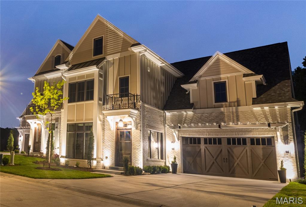 The Enclave at Greenbriar offers a new benchmark for luxury living in St. Louis County. This intimate, gated development is built along the limestone bluffs of Sugar Creek and comprised of 19 thoughtfully arranged residences, beaming architectural integrity with a sense of quiet refinement. A collaborative vision by Novus Enclave LLC, Schaub Architecture, and Duggan Contracting and Carpentry—firms synonymous with high-caliber craftsmanship. Anchoring the community is the gated Enclave Drive, a newly created, private cul-de-sac that gently winds through the Enclave. The address list spans an elegant range of single and double digits (# 2–22), reinforcing the sense of intimacy and exclusivity. Eighteen homes are arranged in a sophisticated double townhome configuration, while the final lot hosts a single, freestanding residence—an architectural centerpiece and a one-of-a-kind offering. Each home sits on its own parcel of land, with double-width driveways and private, attached two-car garages allows a seamless arrival experience. Inside, the homes unfold in spacious, light-filled layouts ranging from 3,100 square feet in the two-story floorplans to over 4,400 square feet in the fully finished three-story residences, which include a main-level hearth room for elevated everyday living. This home shows the full compliment of space including 3 fully finished floors, including elevator to all three floors and hearth room. This premium lot boasts views of forest, limestone bluffs and Sugar Creek.