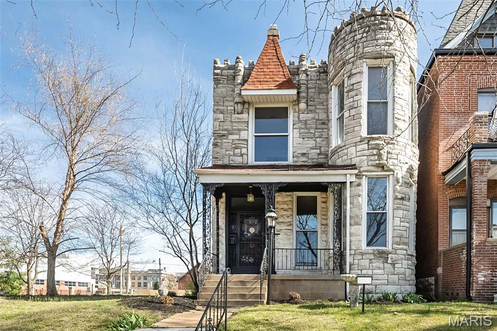Step into a piece of St. Louis history with this stunning 1892 two-story, where timeless architecture and rich character tell a story of the city’s golden era.  Imagine life here in the late 1800s, when horse-drawn carriages lined the streets and St. Louis stood proudly as a gateway of innovation and culture. Today, this home blends that period elegance with modern livability, offering generous bedrooms and inviting living spaces filled with natural light. Showcasing striking stone turrets and classic period details like room-dividing pocket doors, this 4-bedroom, 2-bath residence is a true architectural gem. Inside, you’ll find soaring ceilings on both levels, warm wood floors, decorative fireplaces, and the rare charm of both front and rear staircases—echoing the craftsmanship and thoughtful design of a bygone time. While the home is ready for its next chapter, with some imagination and TLC it presents a wonderful opportunity for the next owner to restore its historic beauty, and bring back the magnificence of its bygone era!  Located across from Ranken Technical College and just minutes from Forest Park, the Delmar Loop, and the Central West End, you’ll enjoy the best of city living with dining, entertainment, and green space at your fingertips. Take in a distant view of the iconic Gateway Arch right from the street—a daily reminder of the city’s enduring spirit.  Book your tour and bring your ideas!!