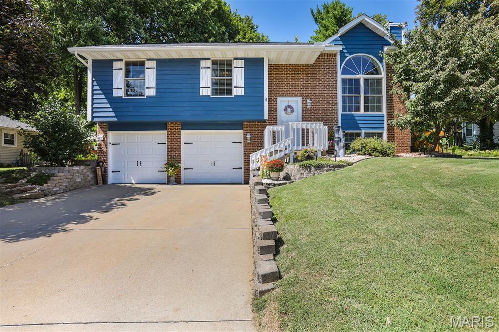 Welcome to this well-maintained three-bedroom home, offering comfortable living spaces, thoughtful updates, and an inviting outdoor setting. Andersen windows with Low-E glass, a roof (2024), water heater (2025), high-efficiency Trane HVAC, LVP flooring (2022), and newer laundry room flooring (2025) provide lasting comfort and peace of mind. The kitchen features quartz countertops, beautiful cabinetry, and a pantry. Solid wood interior doors, insulated garage doors, and an attic with pull-down flooring, storage, and 12 inches of insulation further enhance the home’s functionality. The main level includes a comfortable primary suite, two additional bedrooms, and a full bathroom. The lower level offers a family room with a wood-burning fireplace, laundry area, a versatile bonus room currently used as a playroom, and a half bathroom.
The outdoor spaces provide a lovely extension of the home’s living area, with a comfortable screened/enclosed porch featuring new screens, a 12’ x 12’ concrete patio, a fire pit and gathering area, and a delightful fishpond. The fenced backyard backs to common ground, creating a private, peaceful setting. Additional storage is available beneath the enclosed deck and in a small outdoor closet. The playset stays, along with the swing glider and picnic table on the screened porch. With its comfortable interior, thoughtful improvements, and appealing outdoor spaces, this home is ready to enjoy for years to come.