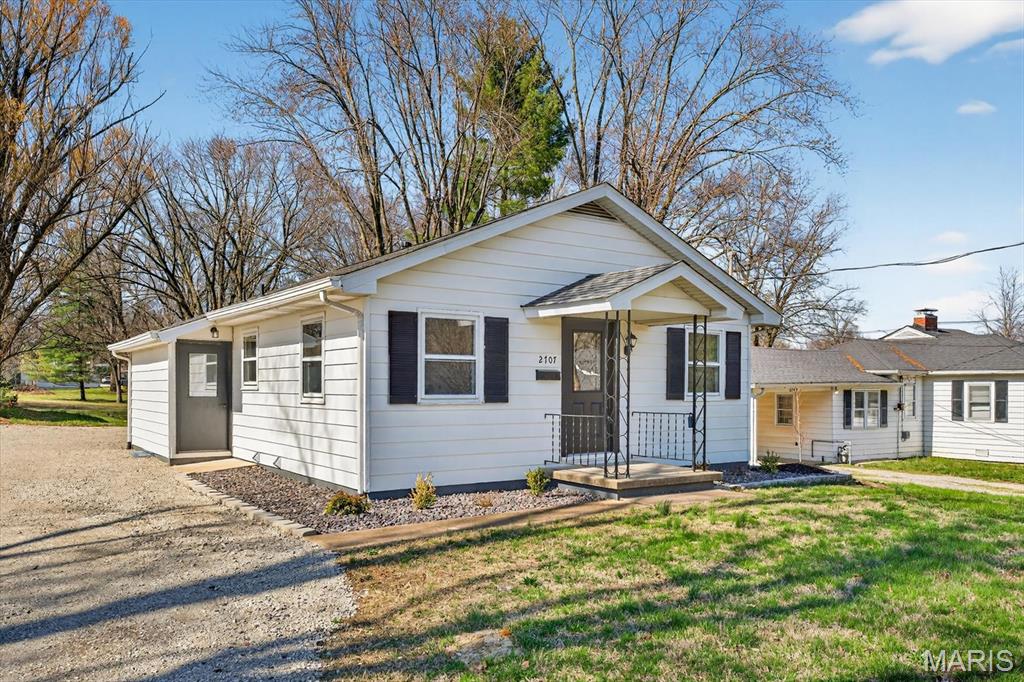 Rare Find: Unmatched Quality in a Reimagined Classic. Step inside and immediately feel the character of this meticulously transformed 2-bed/2-bath home. Every inch has been thoughtfully updated, blending high-end craftsmanship with modern luxury. The heart of the home features Amish-made custom cabinetry set against gleaming 3/4" Hickory hardwood floors. An open-concept kitchen, dining, and living area creates a seamless flow perfect for modern entertaining. The main floor hosts two bedrooms and a full bath w/shower, while the lower level expands your living space with a second full bath, laundry, a private office/craft/flex room, and a versatile area ready for your imagination. Situated on a spacious lot with a large backyard and a 20x24 detached workshop/garage, there is plenty of room for expansion or gardening. The location is hard to beat - Located just 7 miles from Scott AFB, a quick ride to jump on the local bike trail, close to shopping, and just down the road from the revitalized Downtown Belleville. This is truly a "must-see!" *NEW roof, driveway, landscaping, doors, flooring, lighting, kitchen, appliances, A/C, water heater, electric fireplace, wall finishes and a nearly NEW furnace.