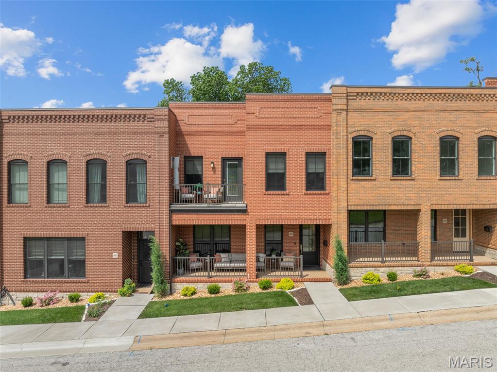 Experience Luxury living in this 2140 sq ft townhome in the heart of downtown Washington! Just a short stroll to local restaurants, shops, and the scenic riverfront park, this exceptional townhome offers the perfect blend of upscale finishes and walkable convenience. 
The open concept main level is designed for both everyday comfort and entertaining in style. You will see luxury vinyl plank throughout, recessed lighting as well as a custom built electric fireplace to really elevate the comfort of your living room. The kitchen features quartz countertops, an island, a custom tile backsplash, premium stainless steel VIKING appliances, and even a custom-built liquor display cabinet that adds a distinctive touch of sophistication. Are you seeing a pattern here? Lots of custom additions in this one! They even added shades that you can control with a click.
Upstairs, the impressive master suite offers a private/screened in walkout balcony with beautiful views of the Missouri River, a spacious walk in closet, and a spa-inspired en suite bath complete with dual vanities, an oversized dual-head walk in shower, and a luxurious soaking bath tub with the same views of the mighty Missouri! Two additional bedrooms provide access to a front balcony,  and close access to another stunning dual vanity full bathroom. 
Thoughtful details are found throughout the home, including crown molding, a coffered ceiling in the master bedroom, custom wallpaper in the powder room and third bedroom/office, and high end finishes at every turn. Even the laundry room is fitted with speed queen commercial washer and dryer, conveniently placed on the upper floor. If you're looking for low-maintenance luxury in one of Washington's most desirable locations, this remarkable downtown townhome is a must see.