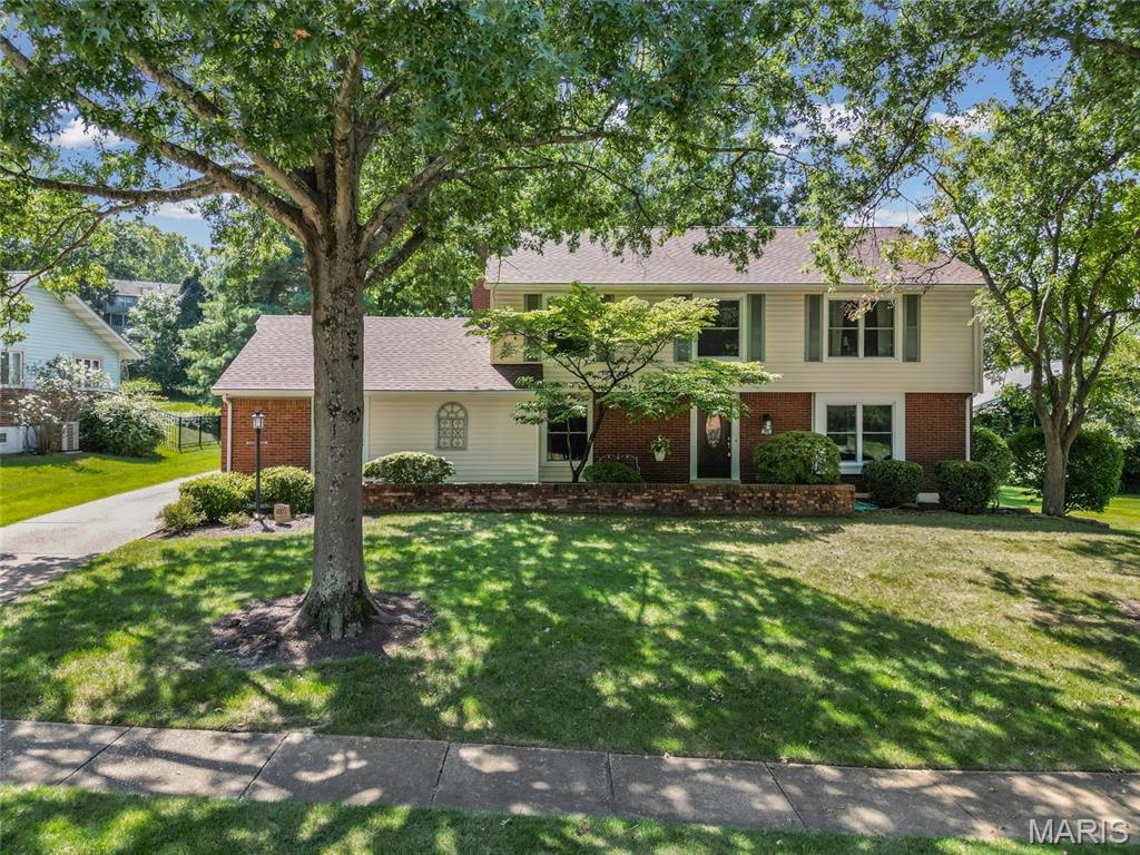 Don't sleep on this one! A stunning, move-in-ready home where modern updates meet timeless comfort with a main floor laundry. The home glows with an abundance of natural light reflecting off beautiful hardwood floors that flow throughout. The updated windows create a bright, airy atmosphere that makes every room feel brand new.

The heart of the home is the thoughtfully updated kitchen, renovated just three years ago. It features crisp white cabinetry, elegant granite countertops, an induction cooktop, and a double oven—perfect for hosting gatherings or preparing daily meals.  The adjacent living space is anchored by a beautiful fireplace, offering a cozy focal point for relaxing evenings.

The primary retreat now boasts a custom-organized closet and an ensuite bath with double sinks. Downstairs, the finished lower level expands your living space significantly, complete with plush new carpet, a full bath, and a versatile sleeping room.

Step outside to the lovely deck, providing a seamless transition to an outdoor space designed for morning coffee or weekend dining. With a one-year-old roof, dual HVAC systems for year-round efficiency, and updated windows, all the heavy lifting has been done for you. This is a rare opportunity to own a meticulously maintained home where every detail has been handled with care.