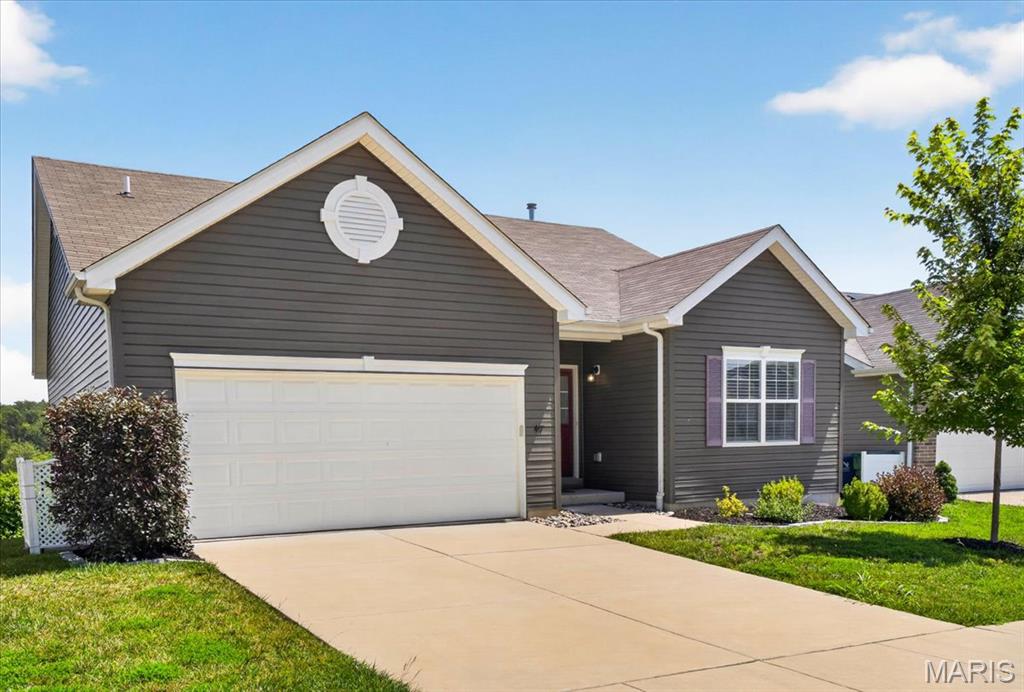 Welcome to this beautifully maintained ranch in the sought after Winding Bluffs community! Built in 2020, this move in ready home offers the perfect blend of modern finishes and comfortable living. The open floor plan features 9 foot ceilings, luxury vinyl plank flooring throughout the main living areas, and an expanded great room and dining area thanks to the popular Aspen floor plan extension. The kitchen is designed for everyday living and entertaining with a large breakfast bar, solid surface countertops, tile backsplash, stainless steel appliances, and a walk in pantry. The spacious primary suite includes a walk in closet and private bath with a marble surround shower, while two additional bedrooms and main floor laundry add everyday convenience. The walk out lower level is ready for your finishing touches and is already roughed in for a full bath. Enjoy peaceful views from the composite deck overlooking common ground. Winding Bluffs amenities include walking trails, stocked ponds, a dog park, playground, and pickleball courts. Showings begin Friday, July 10.
