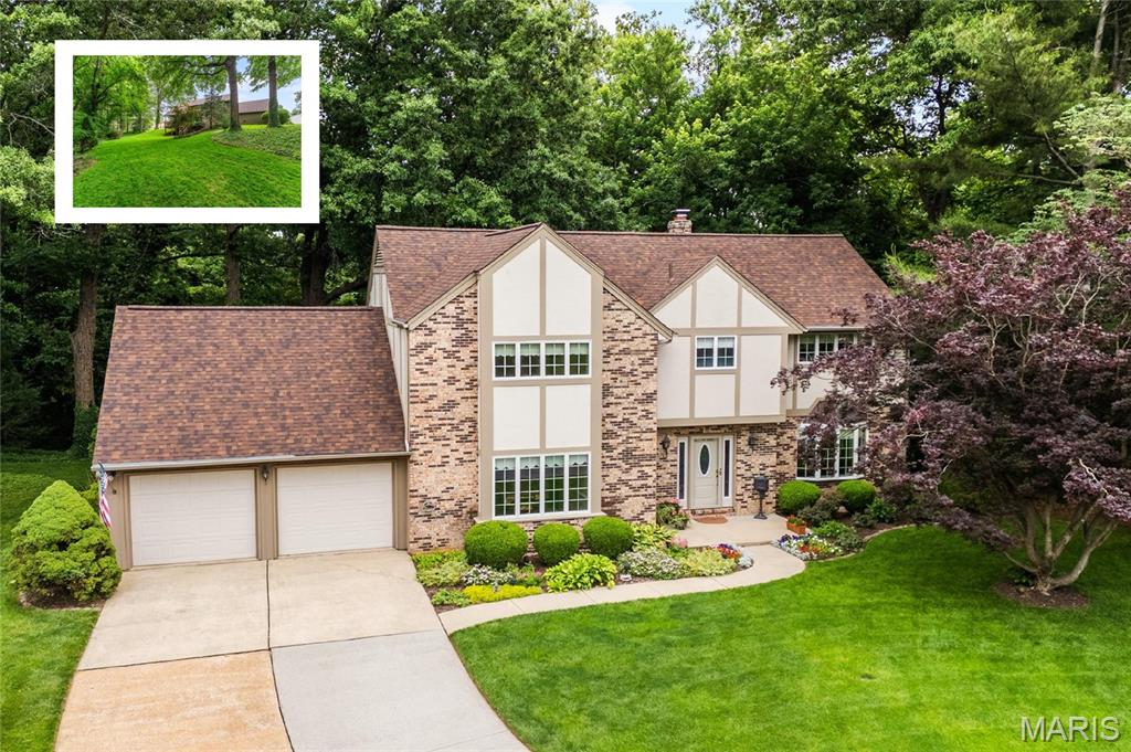 Exceptional partial brick 2-story home tucked away on a quiet cul-de-sac on a rare .64-acre lot in one of O’Fallon’s most desirable neighborhoods! Offering approximately 4,263 sqft of living space including a partially finished walk-out lower level, this home blends comfort, space, and stunning outdoor views perfectly designed for everyday living and entertaining. The oversized eat-in kitchen features granite countertops, tile backsplash, center island, stainless steel appliances, range hood, and abundant cabinetry. The adjoining hearth and living rooms showcase rich wood plank flooring, a striking pass-through wood-burning fireplace, bay window, and open-concept flow between the 2 rooms and kitchen. Main level highlights also include a spacious dining room with bump-out, two half baths, laundry room, and multiple access points to the covered deck overlooking the scenic backyard. Upstairs offers a spacious primary suite with dual closets and private full bath, plus 3 oversized guest bedrooms and an additional full bath. The walk-out lower level is ideal for entertaining with LVP flooring, large rec area, wet bar with sink/fridge, ¾ bath, and extra storage. Enjoy the lower patio for outdoor gatherings. Additional updates include roof & water heater (2025), new front window, front door & sliding glass door (2026), zoned HVAC (2020/2015), and extended 2-car garage. Incredible opportunity to own this beautiful home in O'Fallon Schools.  Schedule your showing today!