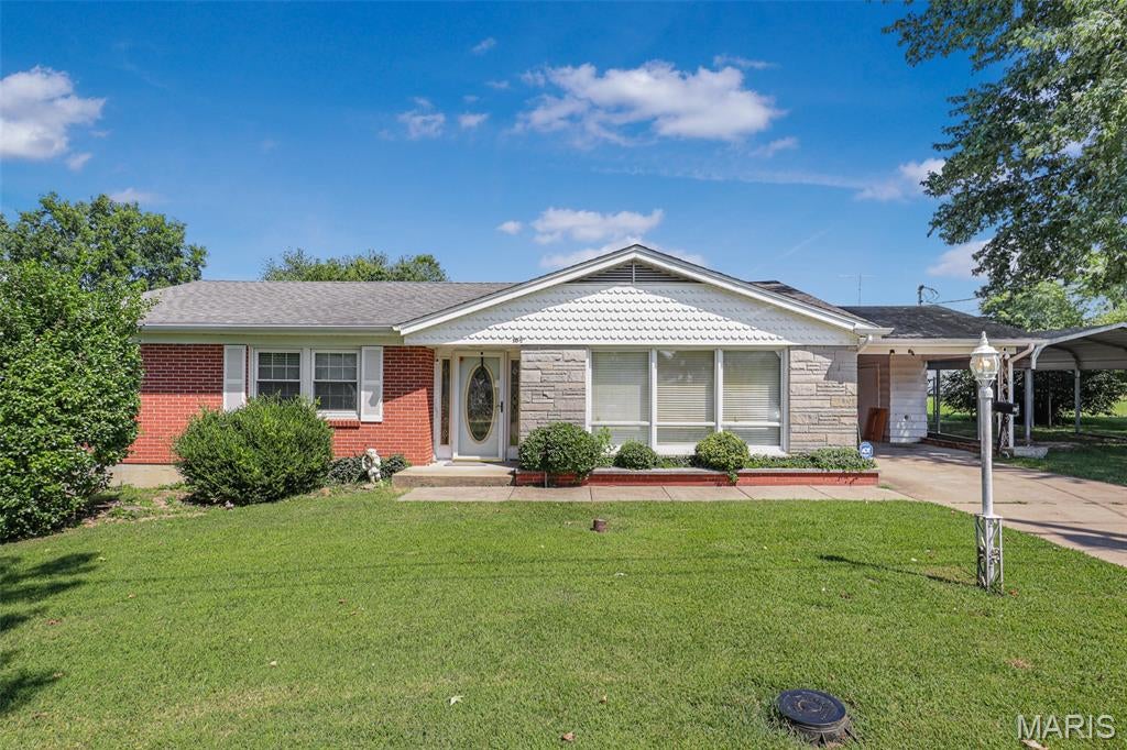 The unique address of 10 1/2 Head Drive features a spacious home full of possibilities! Outside you are greeted with a mixture of brick, stone and scalloped siding, giving this home character and curb appeal. Inside, you'll find single level living including 3 beds, 1.5 baths and 2 additional rooms ideal for an office, play room or storage. The kitchen offers ample cabinet and counter space and is situated between two rooms for gathering, providing flexibility to use the space as you'd like. Outside, a large fenced yard, patio and covered parking complete the package. With a 2,100+ sq. ft. home on over a .5 acre lot, everything about this property is spacious and offers tremendous opportunity for customization!