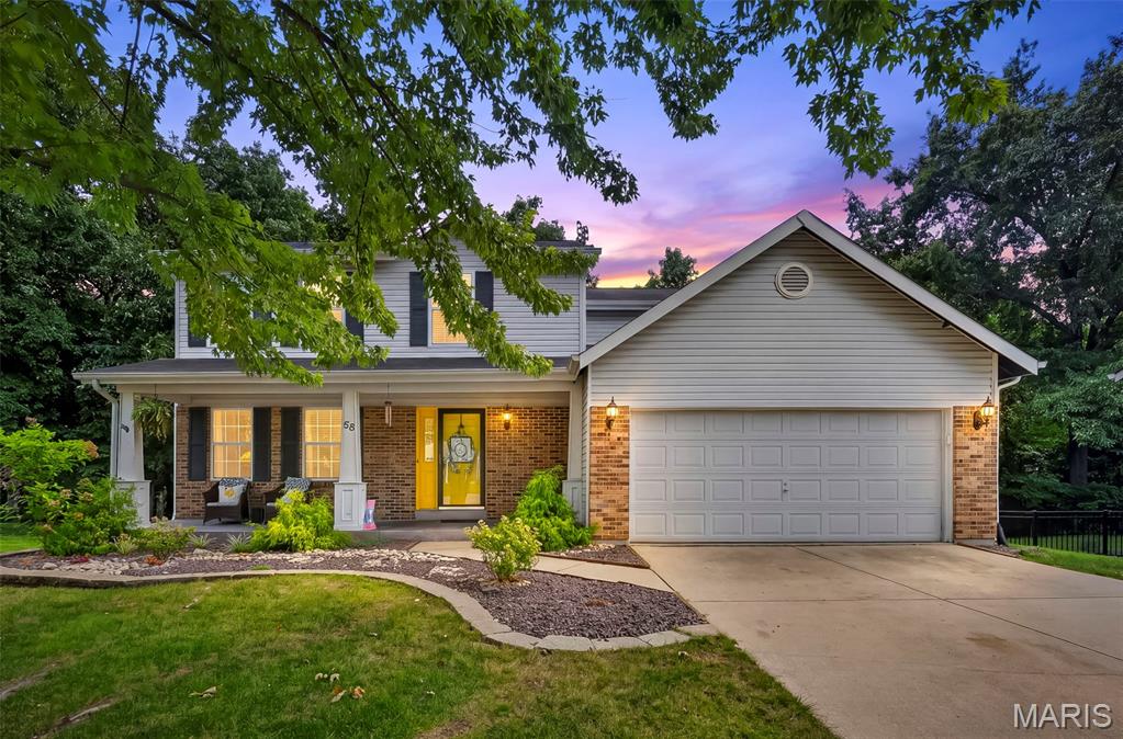 Tucked away peacefully on a quiet cul-de-sac and surrounded by mature trees, this custom designed home offers a warm, inviting retreat with a private, nature-filled setting. From the moment you step inside, thoughtful custom details create a feeling of comfort and character throughout.

The family room is the heart of the home, featuring a cozy fireplace framed by built-in bookcases and storage, along with beautiful custom half-wall wainscoting. The breakfast nook is equally charming, with custom-built storage benches, made-to-size cushions, and a stenciled feature wall that adds a touch of personality.

The gorgeous kitchen combines style and function with soft-close cabinetry, convenient slide-out shelves in the cabinets and pantry, and a retractable concealed range hood. Main-floor laundry adds everyday convenience, with the washer and dryer staying with the home.

Upstairs, you'll find thoughtful touches including metal balusters along the stairwell and landing, ceiling fans and overhead lighting in the bedrooms, and a beautifully appointed bathroom with rainglass shower doors. The expansive primary suite features his and her closets and plenty of space to unwind. The finished basement provides even more flexible living space, while the storage/furnace room offers additional built-in shelving for storage.

Step outside and enjoy your own private oasis. The large composite deck overlooks the expansive, tree-lined lot, while the walkout paver patio—with motion lighting—creates another inviting space for relaxing or entertaining. A spacious 15' x 9' shed tucked beneath the deck provides excellent storage for lawn equipment and outdoor essentials. The oversized garage also features attic storage with convenient drop-down stair access.

With a large private lot, peaceful wooded views, and frequent wildlife sightings, this home offers the rare combination of custom craftsmanship, functional spaces, and a truly serene setting—all tucked away while still close to everyday conveniences. A cozy place to call home and enjoy every season.