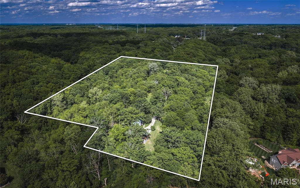 Rare opportunity for builders, investors, or those looking to create their dream home in the highly desirable Wildwood area. This nearly 6± acre tract offers a beautiful blend of privacy, mature timber, and natural beauty, making it an ideal setting for a custom home, small development project, or recreational retreat. Abundant wildlife, including deer and turkey, frequent the property, providing excellent hunting and outdoor enjoyment. Conveniently located near Dr. Edmund A. Babler Memorial State Park and Rockwoods Reservation, you'll have quick access to hiking, horseback riding, wildlife viewing, and countless outdoor recreation opportunities. Whether you're looking to capitalize on Wildwood's strong new-construction market or simply want acreage to build your forever home, this property offers exceptional potential. Existing structures on the property are being sold as-is and add no value. Bring your vision and take advantage of this unique opportunity in one of the St. Louis area's most sought-after locations.