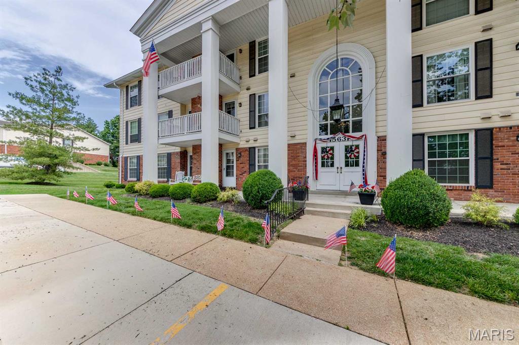 Tucked away in desirable Chesterfield, this Charming 2-Bedroom condo offers easy low-maintenance living. Located on the main floor, this inviting home features an open floor plan with a bright living and dining area, large windows for natural light and a nice size patio.  Living room is welcoming with a fireplace for cozy winter nights.  The kitchen includes ample cabinet space with a large  a breakfast bar.  All kitchen appliances and full sized washer/dryer are included.  Dining area off the kitchen overlooking the patio.    The primary suite offered a walk-in closet and private bath, while the second bedroom is ideal for guests or office.  Roof was installed summer 2025 and electrical updates were done in the past few years for the condo insurance policy.  Enjoy the ease of main-floor living with elevator access to the secure underground parking and extra storage space.   This beautifully landscaped condo community offers peaceful, park-like setting with ample green space.   Residents enjoy the access to a sparkling in-ground pool  and clubhouse.  Wonderful location with highway 40 minutes away and Shopping and dining around the corner at Clarkson and Baxter.