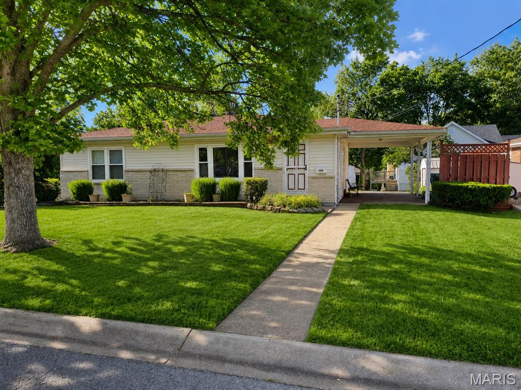Charming 3-bedroom, 2-bath ranch in desirable Webster Groves! The main level offers a spacious living area, three bedrooms, a full bath, and luxury vinyl plank flooring in the kitchen and hallway. The finished lower level provides additional living space with a large recreation room, full bath, and two additional finished rooms offering flexibility for a home office, hobby room, workout room, or guest space. Additional features include an attached carport, storage shed, and convenient access to parks, shopping, dining, and major highways. Sale includes adjacent parcel at 711 Bell Avenue, currently utilized as the property's driveway. Move-in ready and priced at $314,900!