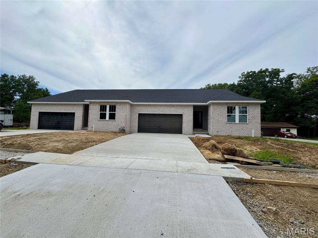 Welcome to this brand-new construction duplex in the heart of O’Fallon, offering modern finishes, spacious living, and a fantastic location! Each side features 2 bedrooms and 3 bathrooms with an inviting open-concept kitchen and family room designed for easy everyday living and entertaining (left side ~1,375 sq ft with ~500 sq ft garage; right side 1,420 sq ft with ~490 sq ft garage). The kitchen shines with Shaker-style soft-close cabinetry, a contrasting island, quartz countertops, and plenty of workspace and storage. Generous bedrooms feature walk-in closets, while thoughtful finishes throughout give each unit a fresh, upscale feel. Each unit also offers a partially finished basement with approximately 725 sq ft, including a spacious family room and full bath, plus tons of unfinished space for storage. Step outside to a covered composite deck overlooking the huge, deep backyard—perfect for relaxing or entertaining. Conveniently located in the heart of O’Fallon and just minutes from downtown, this new-construction property combines modern style and an exceptional location.  Energy efficient 2 x 6 exterior wall construction R 49 ceiling installation R 21 wall installation high efficiency HVAC.  Duplicate Listing 26052598