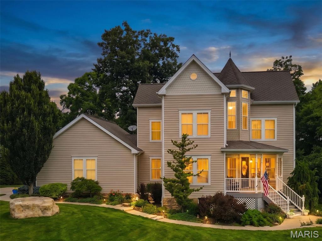 Experience breathtaking views from this beautifully updated three-story Victorian home nestled on 1.76 private acres in the highly sought-after Augusta Shores community. Offering 5 bedrooms, 3 full baths, 2 half baths, and over 3,200+/- square feet of living space, this exceptional property also features an oversized 3-car side-entry garage, a usable level yard and ample space for a future pool. A charming covered front porch and distinctive octagonal foyer create a warm and inviting first impression. The spacious living room showcases hardwood flooring, a gas fireplace, plantation shutters, and direct access to the deck—perfect for enjoying your morning coffee and evening BBQ. The eat-in kitchen is designed for both style and functionality, featuring custom cabinetry, Silestone countertops, a breakfast bar, newer appliances, and a bright bay-window dining area. The main level is completed by a versatile dining room w/ butler pantry, a mudroom w/ custom built-ins and a convenient half bath. The second level offers a spacious primary suite with a walk-in closet and a luxurious en-suite bath featuring dual sinks, a walk-in shower with bench seating, and a freestanding soaking tub. Two additional bedrooms, a laundry room built for a stackable washer/dryer and a full hall bath complete this floor. The third level provides additional living space with a bedroom, recreation room, and half bath—ideal for guests, hobbies, or a private retreat. The 9ft pour on the lower level includes a fifth bedroom w/ cedar closet, full bath, laundry area, and unfinished storage space with endless possibilities. Additional features include an upgraded 50 year rated architectural shingle roof, zoned HVAC system, dual water heaters, 2 separate laundry areas, an oversized 29 ft. x 27 ft. 3 car garage, whole yard irrigation system, a staircase from the garage to the basement and so much more. Residents of Augusta Shores enjoy resort-style amenities, including two gated entrances, four spring-fed stocked lakes, boat docks, a community pool, tennis and pickleball courts, high speed fiber optic internet and scenic hiking trails. This is a rare opportunity to enjoy waterfront living, privacy, and exceptional community amenities in one remarkable property.