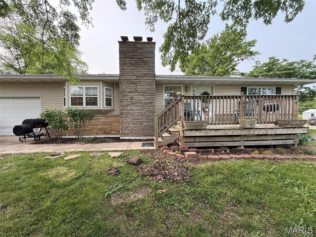 This 3 bedroom, 1 bath home with 1 car garage on a large corner lot in Bland has so much to offer.  This home has all new kitchen appliances, custom fit blinds, refinished original hardwood floors, and updated fixtures, switches & fans.  The full unfinished basement has a working bathroom and space to turn into a 4th non-conforming bedroom.  The large front and back porches with fenced back yard is perfect for entertaining.  The centerpiece of this home is the beautiful rock fireplace in the living room.   This is a clean, solid and move-in ready home!