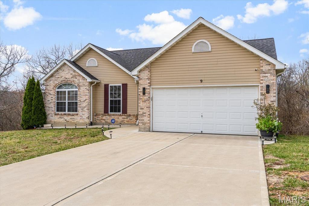 This beautifully updated 3-bedroom, 2-bath ranch home offers over 1,300 sq. ft. of stylish and comfortable living space. With vaulted ceilings in the kitchen, family room, dining room, and entry foyer, this home feels open and inviting.  The brand-new kitchen is a chef’s dream, featuring quartz countertops, custom cabinetry, stainless steel appliances, center island, and vaulted ceilings that enhance its spacious feel. The open floor plan flows seamlessly into the family room and dining area, both boasting gorgeous wood floors that continue throughout the main level. The primary suite is a true retreat, and two additional bedrooms are spacious and share an updated hall bath with modern fixtures. Step outside onto the covered deck where you can relax and enjoy the outdoors in comfort. The walk-out lower level provides endless possibilities.  With top-to-bottom updates, vaulted ceilings, and rich wood flooring, this home is a rare find!