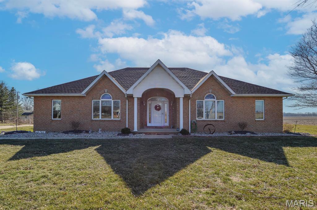 Price listed is Starting Bid Only. Bidding starts closing 04/08/2025 @ 5 p.m.  Experience peaceful country living in this inviting custom built brick ranch, offering three bedrooms, two bathrooms, and the comfort and space for which you have been searching. Designed for easy one level living, this well constructed home features a timeless brick exterior and a practical layout ideal for everyday life. A spacious living room with a gas burning fireplace creates a warm, welcoming centerpiece for relaxing or gathering with family and friends. The open kitchen flows seamlessly into the dining area and includes a large island with an oversized sink and dishwasher, a generous walk in pantry, and all appliances, perfect for cooking, entertaining, and daily convenience. The oversized primary suite provides a private retreat with a large walk in closet and a private three quarter bath. Two additional bedrooms and a second full bath provide flexible space for guests, family, or a home office. Set on 2± acres, the property provides room to spread out while remaining manageable. One acre of income producing tillable land adds value and opportunity. The standout feature is the impressive 36' x 50' pole barn with a poured concrete floor and an attached covered concrete patio, ideal for equipment, hobbies, projects, gatherings, or storage. An attached two car garage adds everyday convenience. A full unfinished basement offers abundant storage and excellent potential for future finishing, allowing you to expand the home’s living space to suit your needs. Located just minutes from I 70 and within the Highland school district, this property combines rural tranquility with accessibility. If you are seeking a solid country home with land, out-building space, and room to grow, this property delivers lifestyle and function in a single appealing package. Property will sell under auction terms and be sold AS- IS, WHERE-IS. Seller, will not make any repairs as a result of any building, occupancy, or environmental inspections. Buyer will be required to sign an Auction Purchase & Sale Agreement if final bid is accepted by Sellers.