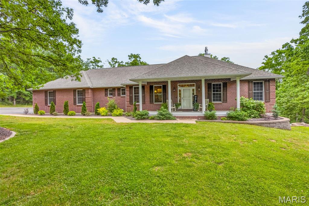 Breathtaking 6-acre setting. This stunning brick home offers the perfect blend of luxury and comfort, surrounded by mature trees and peaceful views in every direction.
Step inside to find a grand living room featuring soaring vaulted ceilings, a striking floor-to-ceiling gas fireplace, and expansive windows that flood the space with natural light while showcasing the beauty of the outdoors.
The heart of the home is a spacious, chef-inspired kitchen complete with granite countertops, an oversized center island, and abundant cabinetry—ideal for both everyday living and entertaining. Enjoy meals in the formal dining room or relax in the charming breakfast nook with bay windows overlooking the property.
The expansive master suite is truly one of a kind, featuring a luxurious, spa-like bathroom and a massive walk-in closet with custom organization. The main floor also includes two additional bedrooms, a full bath, and a half bath—providing both comfort and convenience.



Just off the main living space, unwind on the massive covered and screened-in back deck—perfect for hosting gatherings or enjoying quiet evenings surrounded by nature.



The walkout basement is meticulously finished and offers incredible versatility, featuring luxury vinyl flooring, a stylish bar area, large family room, office, sitting area, two full bathrooms, and a spacious bedroom that could easily serve as a second master suite. An additional sleeping area with a window and a lower-level garage/shop add even more functionality.
Step outside to your beautifully landscaped backyard, complete with a tasteful pergola seating area—an ideal space to relax and create lasting memories.
? This home truly has it all—space, style, and serenity. Don’t miss your opportunity to own this exceptional property.