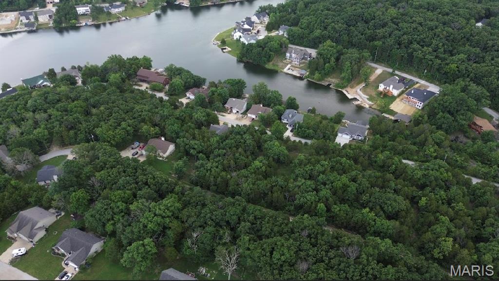 Lakefront Living at Its Finest!  This sub waterfront, buildable lot with breathtaking views offers a perfect canvas for your next dream home right next to new construction. You’ll enjoy convenience and tranquility located just 5 minutes north of Hillsboro and 30 minutes from Greater St. Louis. This is more than just land—it’s a lifestyle.  Amenities include four lakes, a white, sandy beach area, campgrounds, golf courses, swimming pool, fitness center and more. Feel free to explore this amazing opportunity and create your scenic fun-loving lakeside retreat!