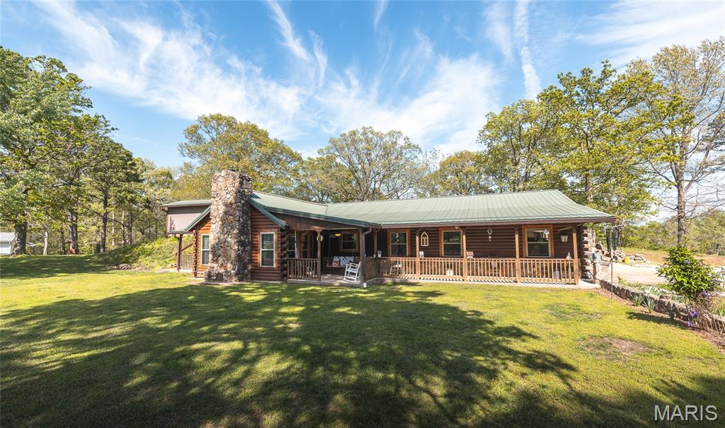Duplicate listing of 26023327. Rarely does a property with such a distinguished legacy become available! This 20.22 +/- acre estate represents a turnkey investment with a 28-year history as a premier rental destination in Dent County. Operating successfully for nearly three decades on a foundation of loyal repeat clientele without ever utilizing modern booking platforms, such as Airbnb and VRBO markets. This versatile property comprises four total living units across three distinct structures, anchored by a primary residence and supported by three dedicated income producing guest units. The primary residence is an energy-efficient earth berm home offering a beautifully appointed 1,884 finished square feet with three bedrooms, two bathrooms, gorgeous hardwood flooring, and custom hickory cabinetry in the kitchen & newer stainless steel appliances. The duplex cabin features two units that each offer a spacious two-bedroom, one-bathroom layout, while the standalone singular cabin provides a cozy one-bedroom, one-bathroom floor plan. Strategically located for the ultimate Ozark experience, the estate sits just 0.7 miles from the renowned Jadwin Canoe Rental - your gateway to floating the crystal-clear Current River with ease. Enhancing it's appeal as a high-yield investment, the nearby Jadwin Canoe rental service provides professional bus pickups & drop offs directly from the cabins, offering guests seamless door-to-river access for canoeing, kayaking, and tubing excursions. Outdoors, you will find mature timber, manicured common areas with picnic tables, and a detached workshop with loft storage and plenty of room for additional guest parking. With it's established reputation, 20.22 +/- acres with room for expansion, and a location that puts guests at the heart of the region's premier recreational corridor, this property should be on your view list!