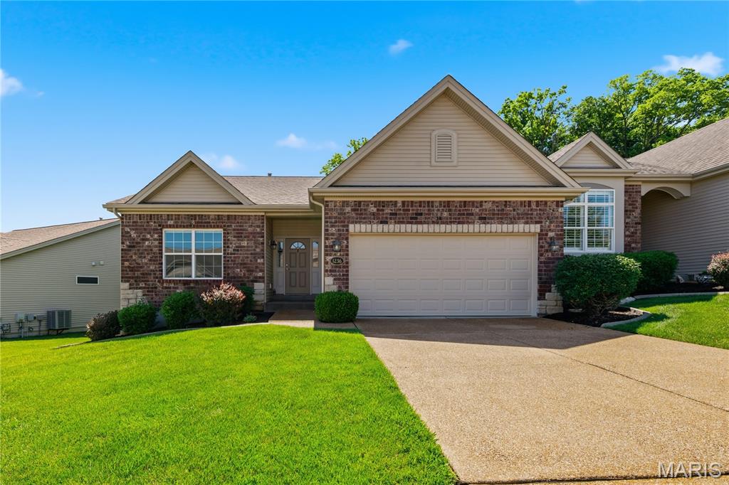 Enjoy low maintenance living in the highly desirable Ohmes Farm neighborhood!  This 3 bedroom, 3 bath villa offers 2,794 square feet of fantastic living space including the finished lower level. The exterior is impressive with brick, stone accents, vinyl siding, landscaping, lawn irrigation and an oversized two-car garage (21.4D). There is a composite deck off the Great Room that overlooks heavy trees.  Features include an open floor plan, 9 foot ceilings, wood flooring throughout the main, 42 inch wood cabinets with crown molding, soft close features, glass display cabinets with lighting, large island with seating bar, gas range, microwave, dishwasher, refrigerator, pantry, bay windows in the Dining area and Primary Bedroom, drop zone at the Owners Entry, double door entry to the secondary bedroom, main floor laundry (accessible from the main living area and the Primary closet), double door entry to the Primary Bedroom, large walk in closet, raised height double bowl vanities in the Primary Bath, shower with seat and more. The finished lower level offers a full bath with shower, bedroom with egress window and walk in closet, a large Rec/Family Room with luxury vinyl plank flooring and a wet bar. The Kitchen refrigerator and gas grill on the deck are included in the sale. A monthly fee covers lawn care, landscaping, snow removal (per indentures), irrigation water and more. Students will attend the sought after Fort Zumwalt Schools. Beautiful Westhoff Park is a short walk away. There is easy access to Highways 70 and 364, shopping, restaurants, services and more.  This home presents an amazing opportunity to be a part of an outstanding neighborhood.