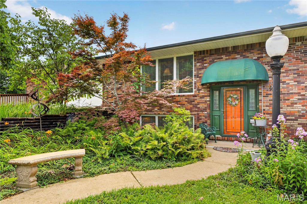 Calling all car enthusiasts! This one-of-a-kind 4-bedroom, 3-bath split-level home offers an incredible 6-car garage and is packed with character, history, and space. Situated on 2.41 private acres across two lots, this is the last home in the Jacob Westerman Estates subdivision backing to the beautiful Meramec River. The backyard is truly a private oasis, offering breathtaking views and endless opportunities to relax or entertain. The highlight of the outdoor living space is the impressive three-level deck, providing multiple areas to enjoy your morning coffee, host family and friends, or simply take in the peaceful river scenery. Unwind after a long day in the hot tub (included with home) while enjoying the tranquil surroundings. Originally built as a ranch in 1961, the home was thoughtfully raised and expanded into a spacious split-level design, adding valuable square footage along with additional bedrooms and bathrooms. The result is a unique home that blends timeless charm with modern functionality. Lovingly maintained by its owners, this home offers peace of mind with a 1-year-old roof, well-maintained major systems, and a whole-house generator valued at approximately $20,000, ensuring you're prepared during severe weather and power outages. Whether you're looking for room to store your vehicles and hobbies, a private retreat surrounded by nature, or the charm of river living, this exceptional property truly has it all. Homes like this don't come along often—schedule your showing today before it's gone! Professional photos coming 7/9.
