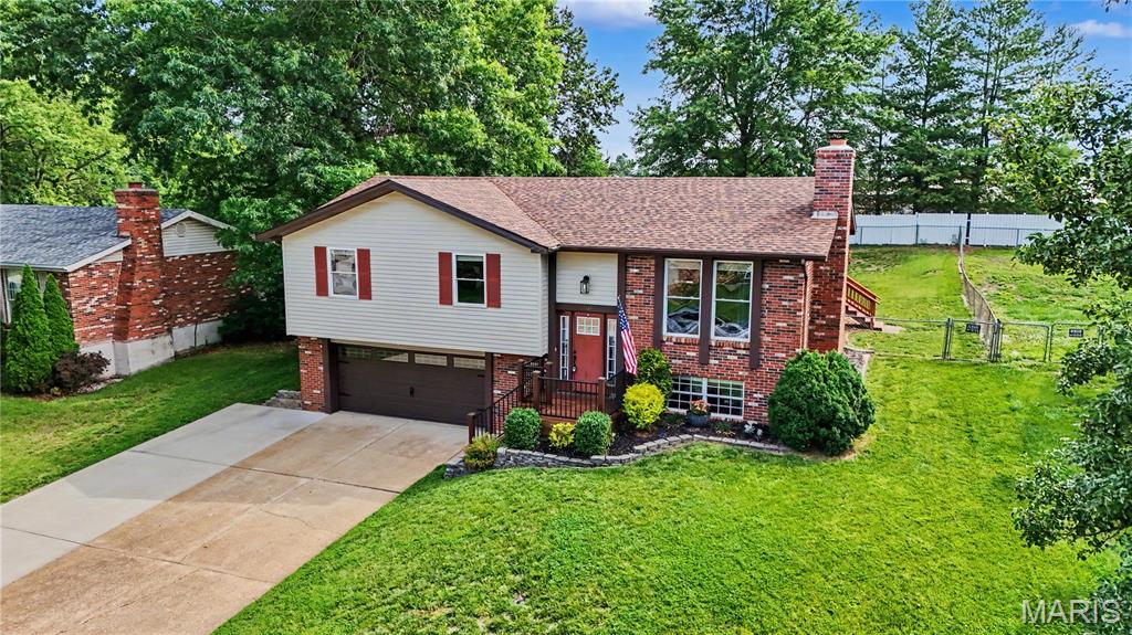 OPEN HOUSE SATURDAY 11-1!!! Welcome to this beautifully renovated split-foyer home offering 1,660 total square feet of stylish and functional living space. This move-in-ready home features 3 bedrooms, 2 full baths, and numerous updates throughout, including a new roof installed in 2023. The heart of the home is the upgraded kitchen, showcasing stunning granite countertops, modern finishes, and a custom kitchen island accented with rustic barn wood trim that adds warmth and character. Attractive Pergo laminate flooring flows through the main living areas, creating a cohesive and low-maintenance living environment. The spacious layout offers comfortable living and entertaining space on both levels, while the finished lower level provides additional room for a family room, recreation area, home office, or guest space. Step outside to enjoy the oversized deck overlooking the fully fenced backyard—perfect for outdoor gatherings, grilling, pets, or relaxing evenings at home. Combining modern updates, unique custom touches, and practical living space, this home delivers exceptional value in a convenient Arnold location. Schedule your private showing today and see all this beautifully updated home has to offer!
