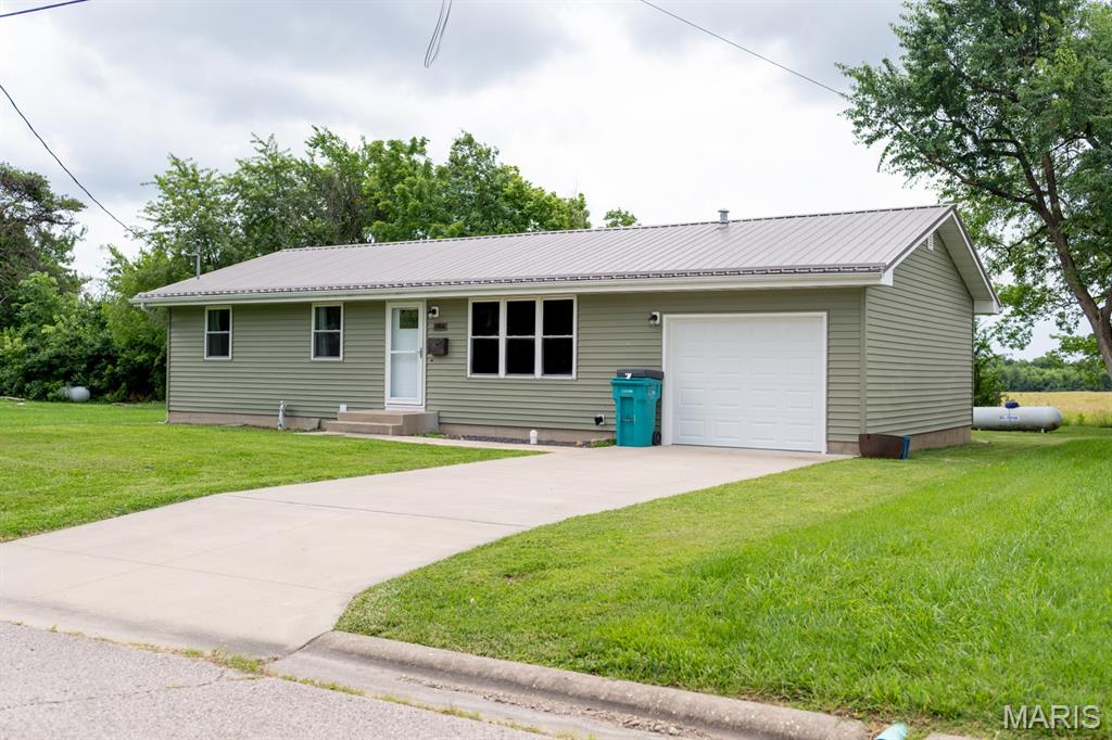 Charming and affordable ranch home in the heart of Owensville, MO, offers approximately 1,040 square feet of comfortable living space and is conveniently located near shopping, parks, and local amenities. The main level features a practical floor plan with three bedrooms, a spacious living area, and plenty of natural light. A full basement provides excellent storage space and potential for a workshop, hobby area, or future expansion. The one-car attached garage adds everyday convenience, while the front and back yards offer room for gardening, outdoor activities, or simply relaxing. With public utilities, central air, forced-air heat, and a durable metal roof, this property is ready for its next owner. Whether you're a first-time homebuyer, looking to downsize, or searching for an investment opportunity, this Owensville home is one you won't want to miss!