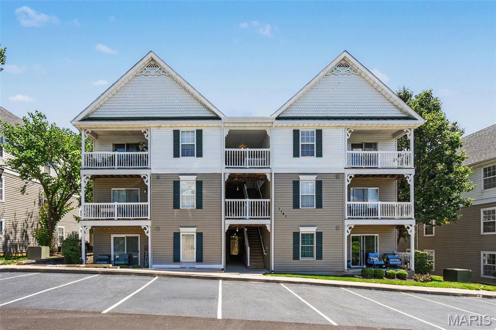 Welcome home to this beautifully updated top-floor condo in the Arbor Creek community! Featuring 2 bedrooms, 2 full bath (popular split bedroom floorplan) and soaring vaulted ceilings, this light-filled residence offers an open and spacious floor plan designed for comfortable living and effortless entertaining. The living room opens to a private covered balcony overlooking peaceful woods and Grand Glaize Creek, creating a serene backdrop for morning coffee or evening sunsets. 
The kitchen offers stainless steel appliances, ample cabinetry and a breakfast bar that flows seamlessly into the dining and living areas. The spacious primary suite features a large walk-in closet and private bath with a double-sink vanity, while the split bedroom layout provides added privacy for guests or a home office. 
Additional highlights include in-unit laundry, updated flooring, private storage and newer mechanicals. Conveniently located just minutes from Highways 270, 141 and 44 with easy access to shopping, dining, parks and all that West County has to offer. Situated within the highly regarded Parkway School District, this move-in-ready condo combines comfort, convenience and scenic views in one exceptional package.