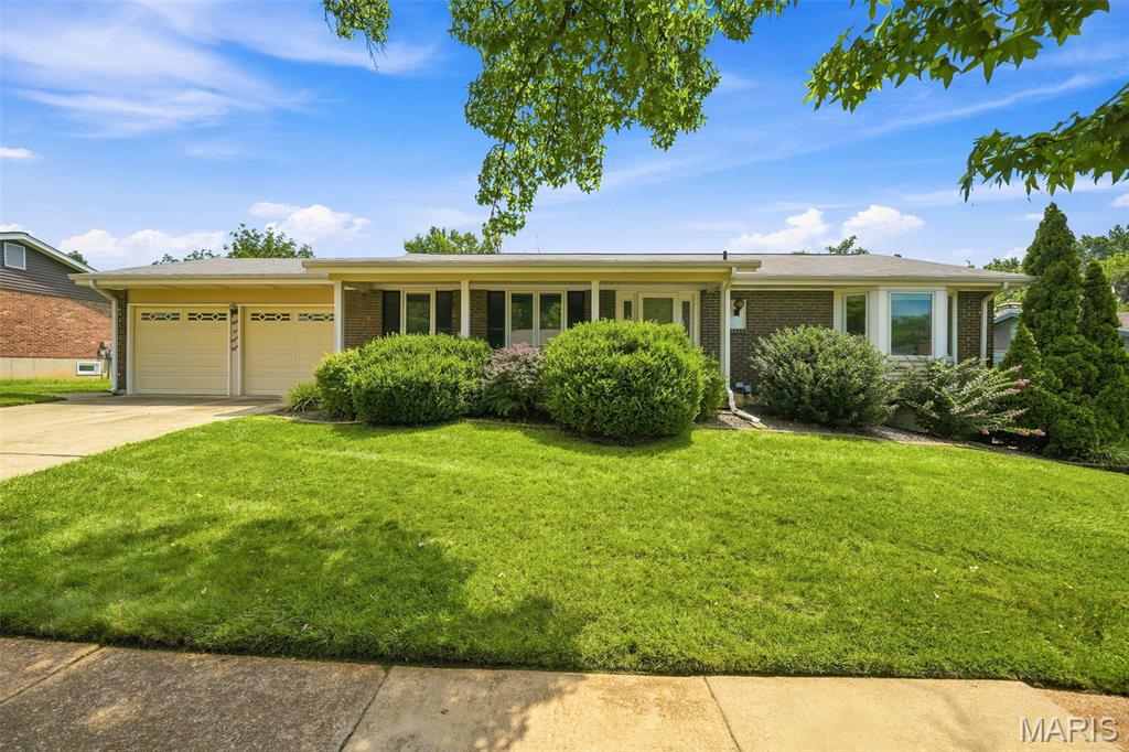 Welcome home to this nicely maintained 3-bedroom, 2-bath ranch in beautiful Oakville! The main floor features nice wood flooring throughout, a spacious living room and dining room, and a warm, inviting family room with a gas fireplace! Walk out from the family room to the backyard—perfect for relaxing or entertaining! The kitchen has been beautifully updated and has a great center island!  Additional highlights include nice newer windows, a 2-car garage, and an irrigation system to help keep the lawn looking its best! This move-in-ready home combines timeless charm with modern updates and is ready for its next owner! Schedule your private showing today!