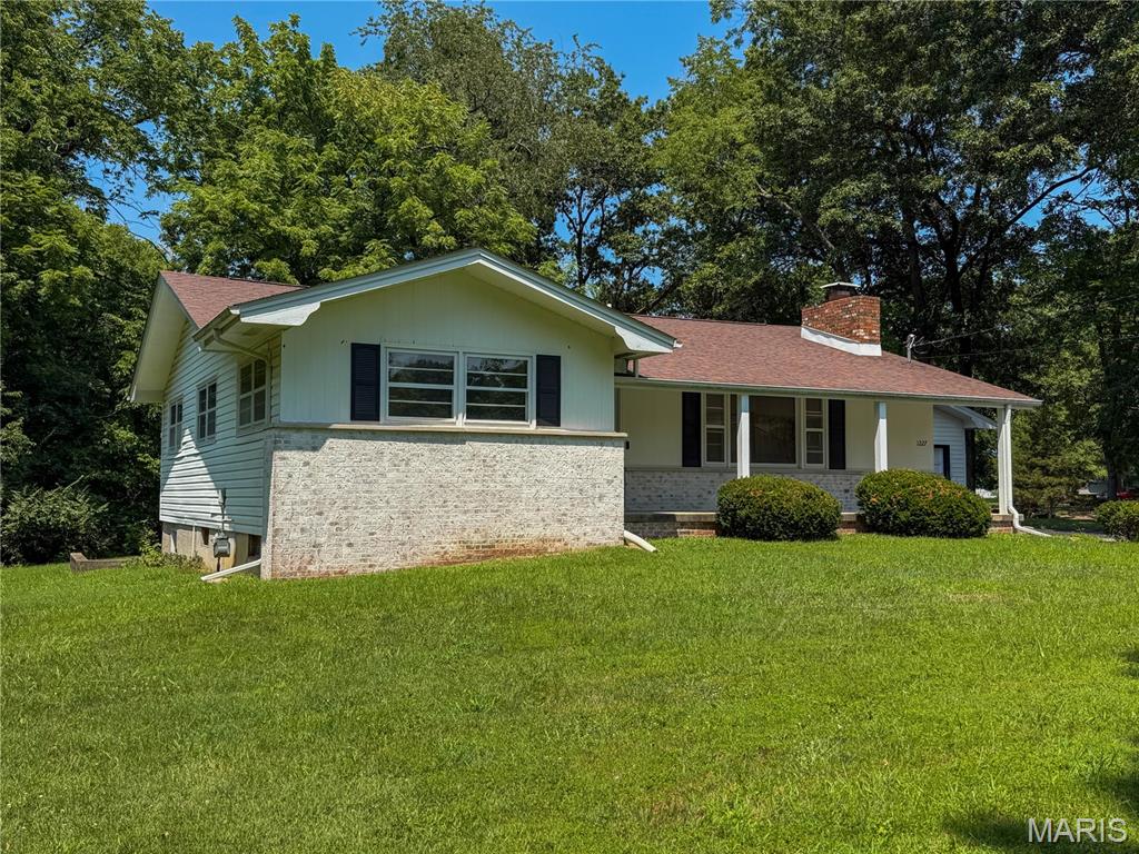 Enjoy an out-of-town feel without giving up in-town convenience at this charming 3-bedroom, 1.5-bath ranch on more than 1.5 mostly wooded acres. Positioned at the end of a dead-end street, the home offers over 1,300 square feet of comfortable one-level living in a setting that feels pleasantly removed. Large windows bring abundant natural light into the spacious living room, where a wood-burning fireplace creates an inviting focal point. The kitchen pairs stainless steel appliances and modern finishes with ample cabinetry, keeping everyday cooking and storage practical. Downstairs, the unfinished walk-out basement is ready to adapt to your needs. Its generous footprint provides plenty of room for projects, hobbies, a workshop, seasonal items, or future improvements. Direct outdoor access also makes moving tools, materials, and larger items in and out more convenient. Outside, the expansive yard and wooded surroundings provide a welcome sense of privacy. The oversized detached 2-car garage accommodates parking while leaving additional room for storage, and a separate backyard shed keeps lawn tools and outdoor equipment organized. Come explore the space, versatility, and distinctive setting this property has to offer—schedule your showing today!