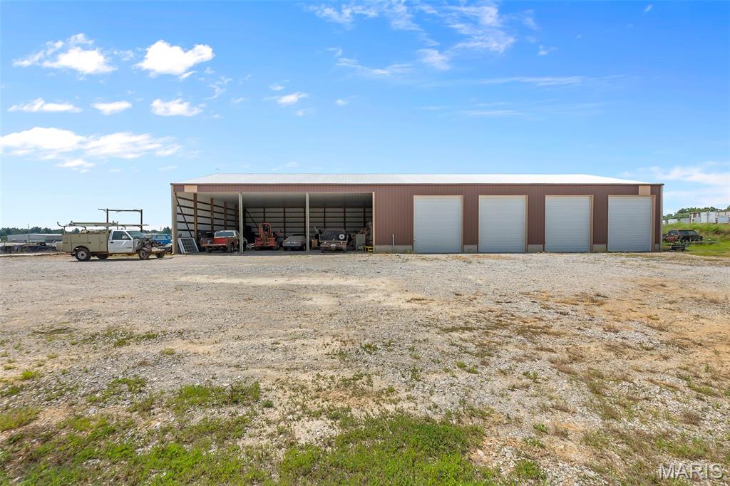 50x120 (6,000 sq ft) building constructed in 2018, measures and includes four 12' x 14' overhead doors plus three open bays ideal for equipment, fleet, RV, or contractor storage. Two enclosed bays are leased at $225/month each and include heat and electric. Additional income potential by renting additional bays. Situated on approximately 1 acre.