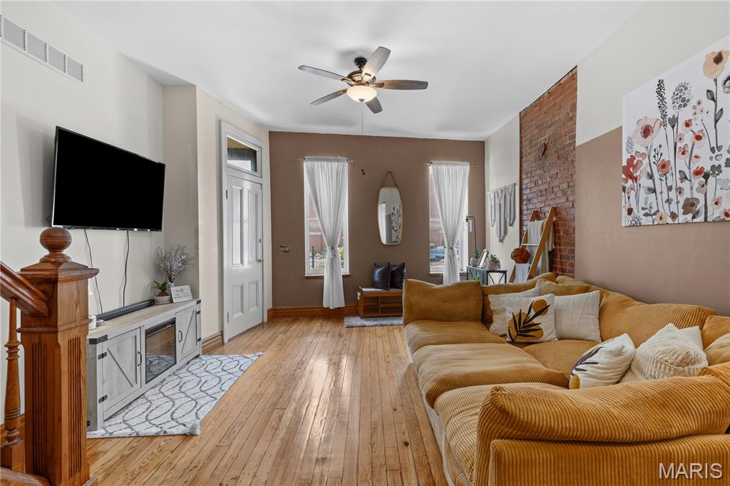 Step into historic elegance with this stunning 3-bedroom, 1.5-bathroom Victorian row house, beautifully located in the heart of Soulard.

The bright, open-concept floor plan seamlessly connects the living and dining rooms, making it an entertainers' dream. You'll love the high ceilings, gorgeous refinished hardwood floors flow through the space, leading to an updated kitchen that features custom wood cabinetry, beautiful countertops, a sleek subway tile backsplash, and stainless-steel appliances.

The second floor features a spacious primary bedroom, a secondary bedroom, and a large full bathroom with a double vanity. The versatile third floor offers an expansive open layout—perfect for extra storage, a private home office, or a yoga studio. Additionally, the partially finished basement provides excellent extra living space and a convenient family room or additional office setup.

Located directly across from the Anheuser-Busch Brewery, you are just a short walk away from neighborhood favorites like the 9th Street Deli and Frazer’s. Enjoy the best of South City living with nearby parks, incredible nightlife, and easy access to major transit lines.

This 3-bed, 1.5-bath Soulard row house masterfully blends 1885 historic charm with modern updates. Close proximity to the AB Brewery and wonderfully located, it offers the ultimate walkable city lifestyle.