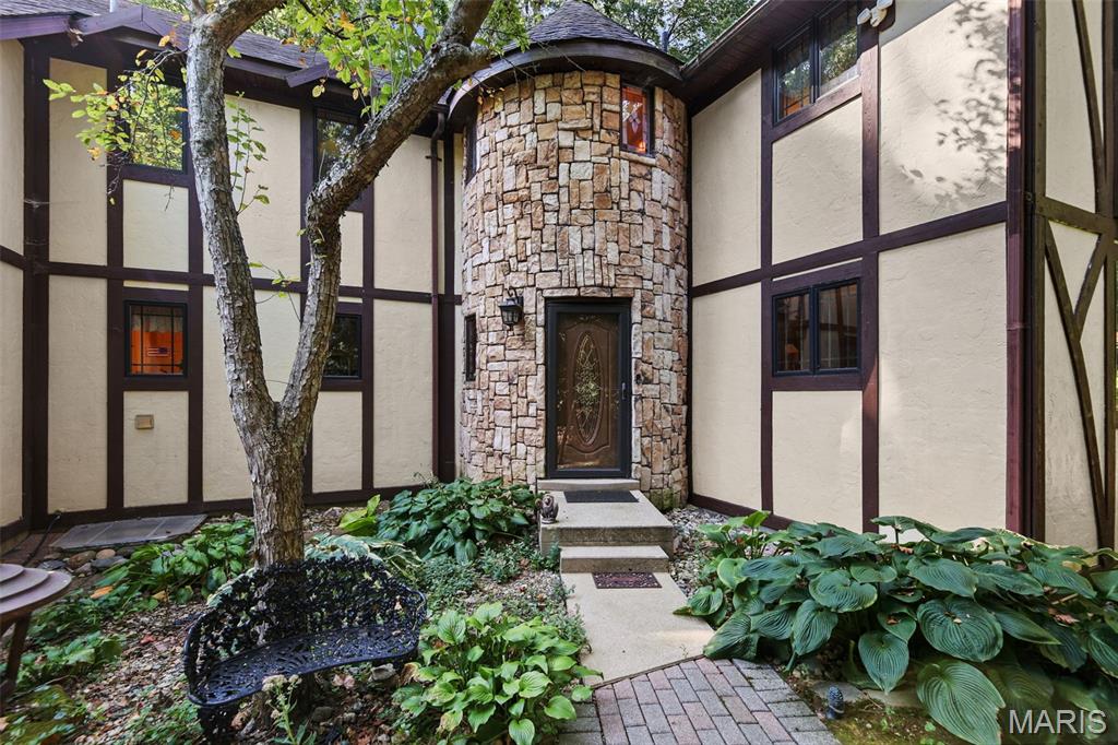 This remarkable English Tudor home is nestled on 1.09 acres in the heart of the Metro East, Illinois, offering a private retreat with convenient access to the St. Louis metropolitan area. Its striking Tudor-inspired architecture, combined with seamless indoor-outdoor living spaces, creates an atmosphere of tranquility both inside and out.

Thoughtfully updated for modern comfort and efficiency, the home features numerous energy-efficient improvements, including a whole-house generator (2026), a beautifully renovated kitchen (2017), updated HVAC system, water heater with heat pump technology, electric vehicle charging stations, and more. This exceptional property blends timeless character, privacy, and contemporary convenience in one outstanding setting.