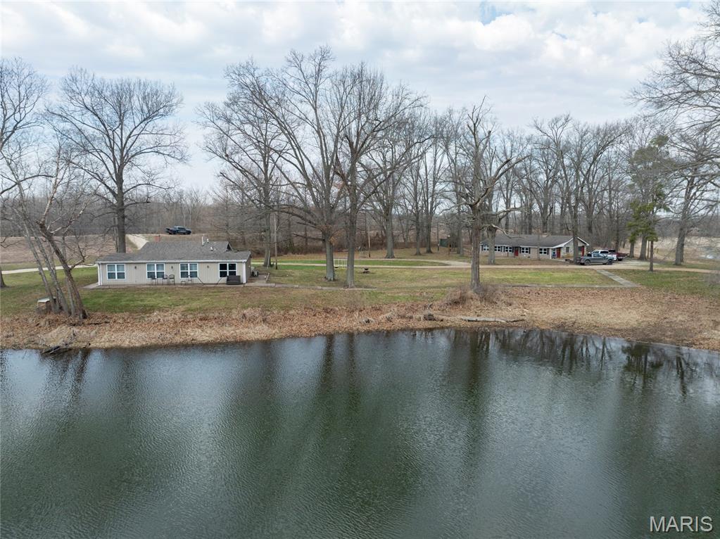 It’s not often a property like this comes available in Calhoun County. This 149 acre turnkey waterfowl and whitetail hunting operation sits in the heart of an area known for producing consistent duck numbers, and it’s set up the right way from top to bottom. Approximately 137 acres of the property are enrolled in WRP, and it provides tremendous habitat for ducks, geese, giant whitetails, and abundant turkeys.

This is a property built for reliability. The leveed duck impoundment is supported by a deep well with a 12-inch discharge, allowing you to control water levels when it matters most. Whether you’re holding birds during migration or keeping water open when conditions tighten up, this system gives you an advantage that many properties simply don’t have.

The hunting setup is already in place and ready to go. Two buried pits are strategically positioned within the impoundment, offering excellent concealment and the ability to hunt varying wind conditions. The surrounding area is well known for strong duck traffic, and this farm sits right in the middle of it.

Beyond waterfowl, the property offers tremendous whitetail deer hunting along with a strong population of turkeys. The combination of habitat, food, and surrounding landscape creates a year-round recreational property that checks multiple boxes for serious outdoorsmen.

The improvements on this farm are just as impressive as the land itself. A very nice lodge overlooks the duck impoundment, giving you a front-row seat to morning hunts and evening flights. In addition, a guest house featuring four bedrooms and four bathrooms sits overlooking beautiful wetlands, making this property ideal for hosting family, friends, or clients.

Functionality was clearly a priority in the design of this property. A diesel power plant with fuel tank supports the well system, most of the acreage is levee protected, and an open machine shed provides ample storage for equipment. To make the transition seamless, a tractor and disk are included in the sale.

Access is excellent with a well-maintained gravel road leading to a gated entrance, providing both convenience and privacy.

This is a true turnkey recreational property in one of Illinois’ most sought-after waterfowl regions. Everything is in place for the next owner to step in and start hunting on day one.

If you’re looking for a property that offers dependable duck hunting, strong deer and turkey opportunities, and the ability to comfortably host and enjoy it with others, this is one you need to see.

KEY FEATURES
149 acres in Calhoun County, Illinois
Turnkey waterfowl, whitetail, and turkey hunting property
Located in the heart of a highly regarded duck hunting area
Leveed duck impoundment with controlled water management
Deep well with 12-inch discharge
Diesel power plant with fuel tank
Two buried duck hunting pits
Majority of property levee protected
2,200 Sq Ft 1 bed, 1 bath Lodge overlooking the duck impoundment
1,700 Sq Ft guest house with 4 bedrooms and 4 bathrooms overlooking a scenic wetlands
Open machine shed for equipment storage
Tractor and disk included
Excellent gravel road access
Gated entry for privacy and security