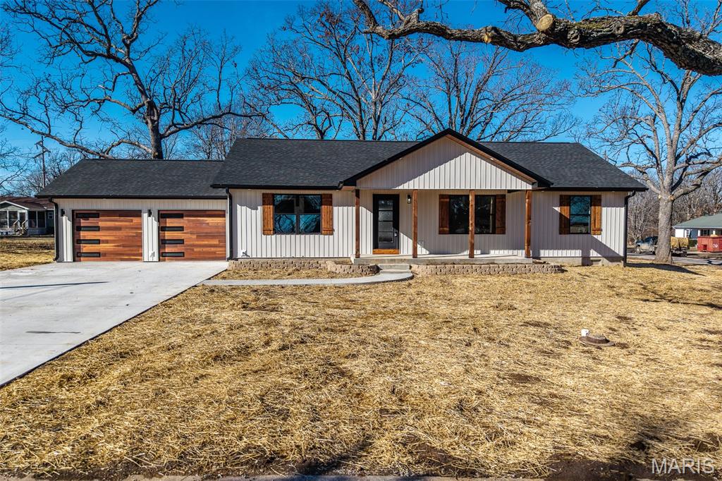 Brand new construction showcasing modern design and high-end craftsmanship throughout. This thoughtfully built home features an open-concept layout anchored by a spacious living area and enhanced by custom finishes, including upgraded countertops and cabinetry, detailed tile work, premium garage doors, and exterior soffit lighting, along with numerous additional custom details throughout. Every finish was carefully selected to balance style, durability, and everyday functionality.

The kitchen opens seamlessly to the main living space, creating an ideal setting for entertaining or comfortable day-to-day living. The primary suite offers a private retreat with generous closet space and a well-appointed bathroom featuring quality finishes and attention to detail. Additional bedrooms are spacious and versatile, easily accommodating guests, a home office, or a growing household.

Quality construction is evident throughout, from the trim work to the mechanical systems, providing long-term peace of mind. The home is serviced by Laclede Electric rather than city electric, offering an added benefit many buyers prefer. Situated on a nice lot in a convenient location, this low-maintenance, move-in-ready home delivers the advantages of refined new construction—without the wait. Schedule your showing today to experience everything this home has to offer.