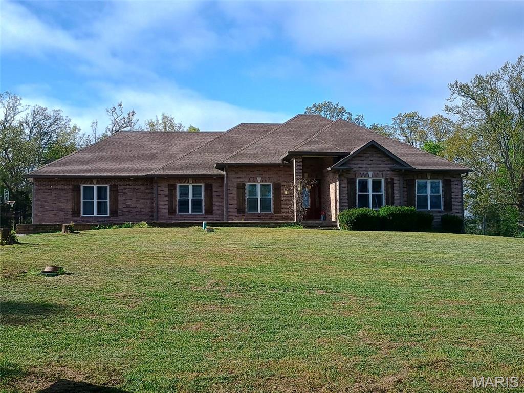 VIP 4981  
JUST REDUCED!!!  PRICED BELOW APPRAISAL! Custom Built Country Home boasts 5 Bedroom 3.5 Bath Brick home with custom mill work throughout the home, 2 car attached garage with additional garage for mowers, etc. and storage in garage.  Has a 20 x 60 Greenhouse on the property as well for those gardeners!   
Property is not in City Limits and has Intercounty Electric and County #2 water. 
Main home Kitchen has lots of Custom Cabinetry , beautiful Center Island, Wine Cooler, Microwave and so many additional touches! Separate Dining area with wood flooring, Living Room with 11 foot ceilings and a view of the Patio leading out to the In Ground Pool with a slide.
 BONUS is a 16 x 60 Green House with an outside Wood Furnace that can heat the Main Home and water. Main home has a Lenox Heat Pump with electric backup.  Workshop has a gravel floor. Utility shed also on property.